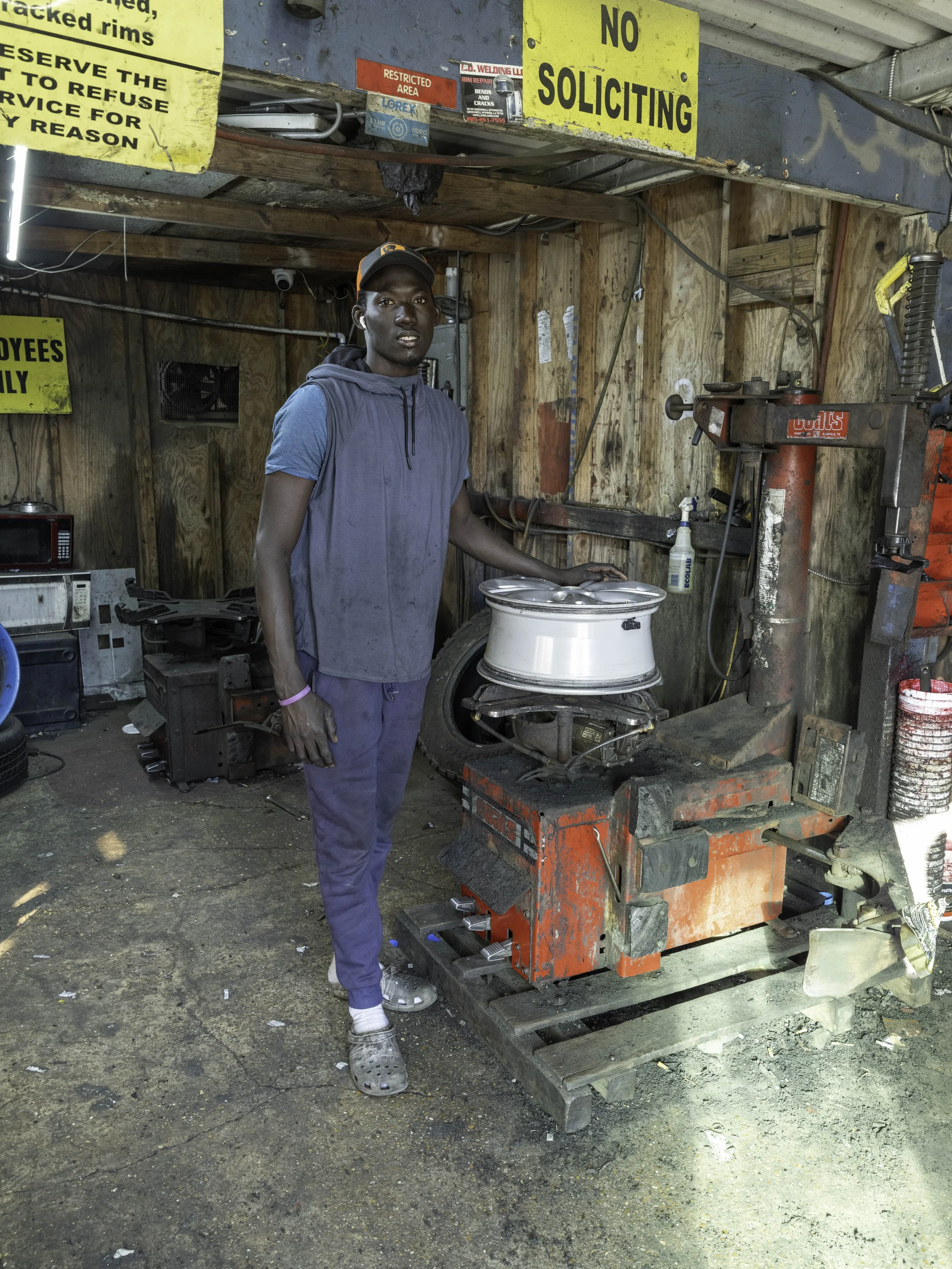 Tire mechanic from Senegal.
