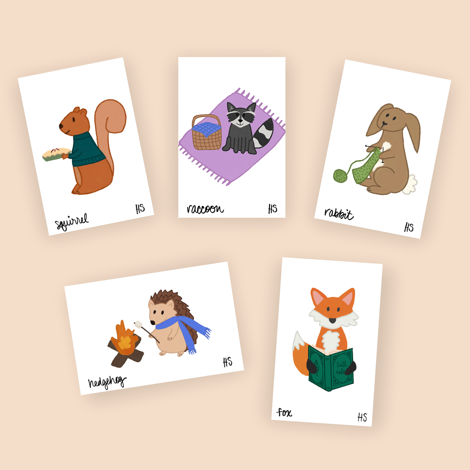 Mini print collection of woodland creatures including a squirrel holding a pie, a raccoon on a picnic, rabbit knitting, hedgehog roasting a marshmallow, and fox reading