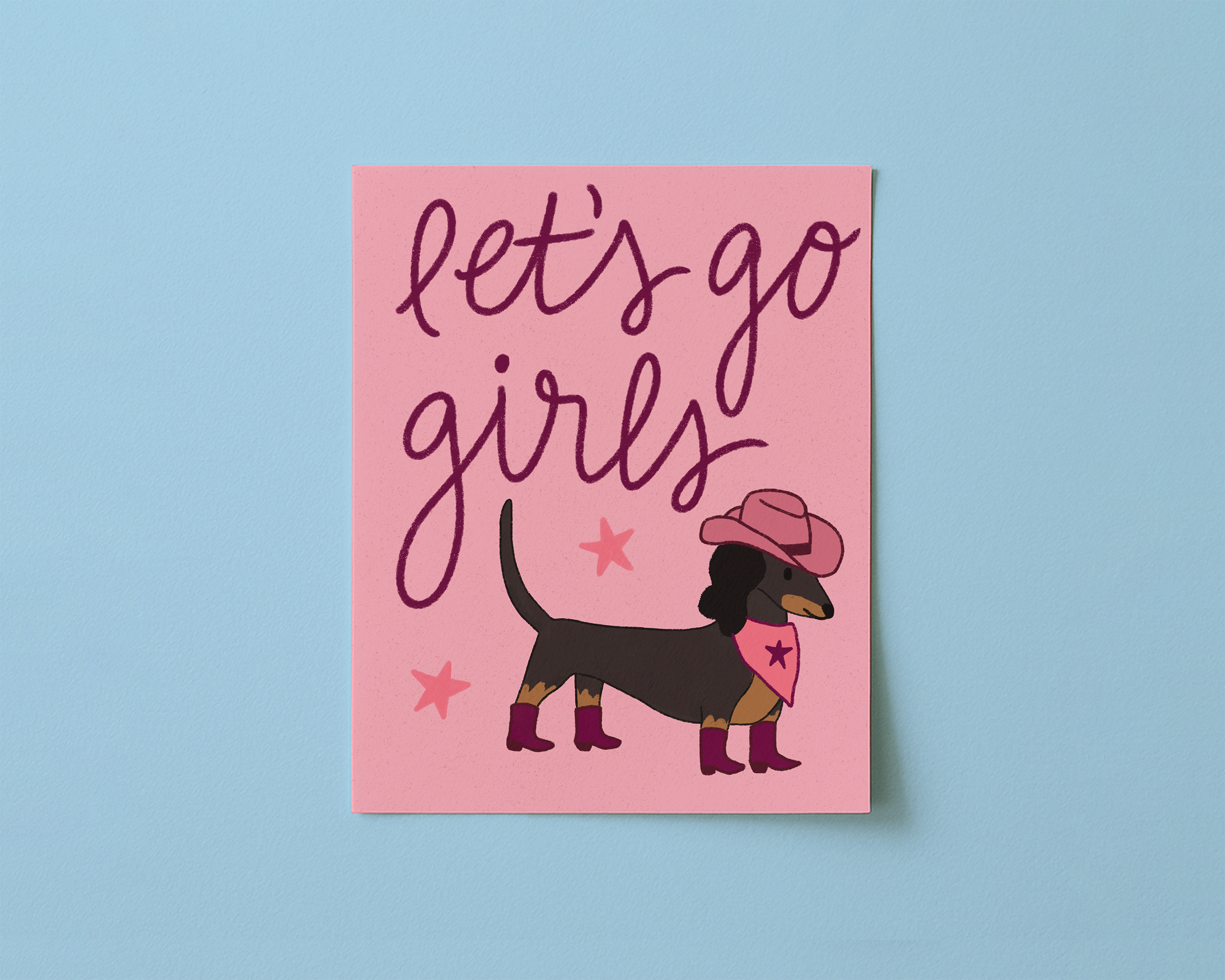 Art print with pink background and dachshund wearing a cowboy hat, reading "Let's go girls!"
