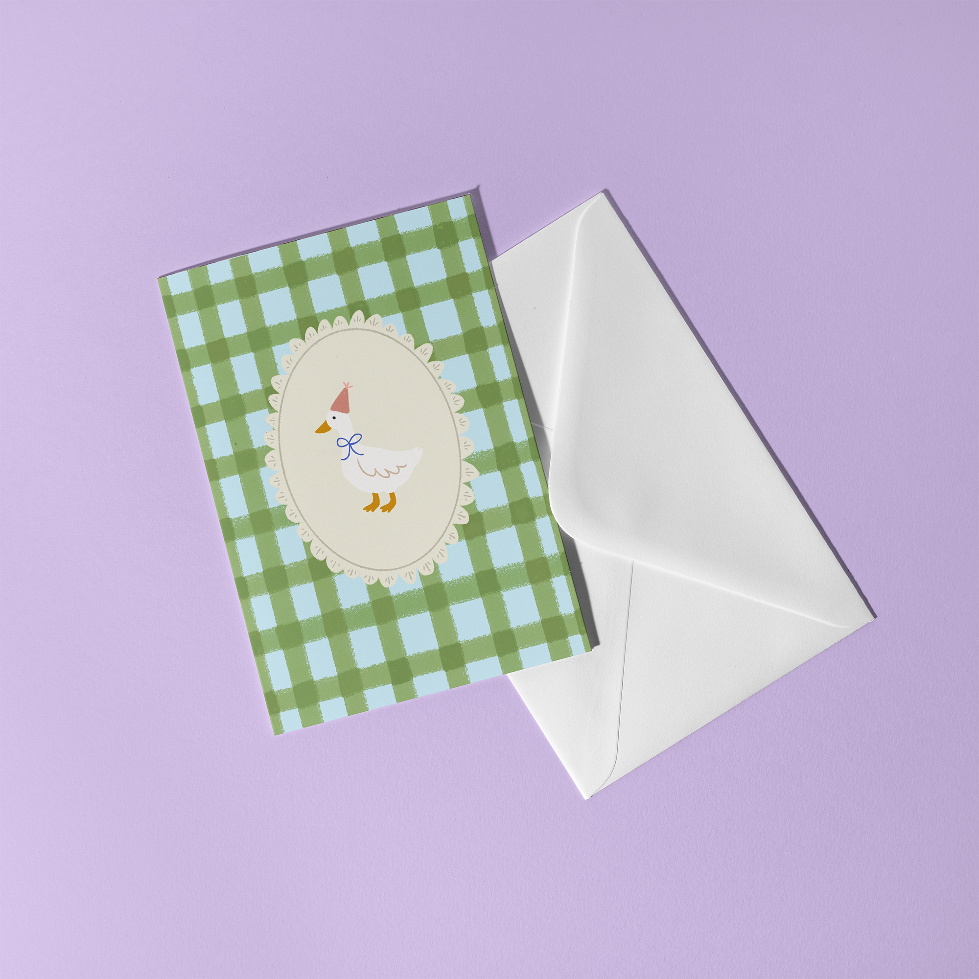 Green gingham greeting card with a goose wearing a party hat