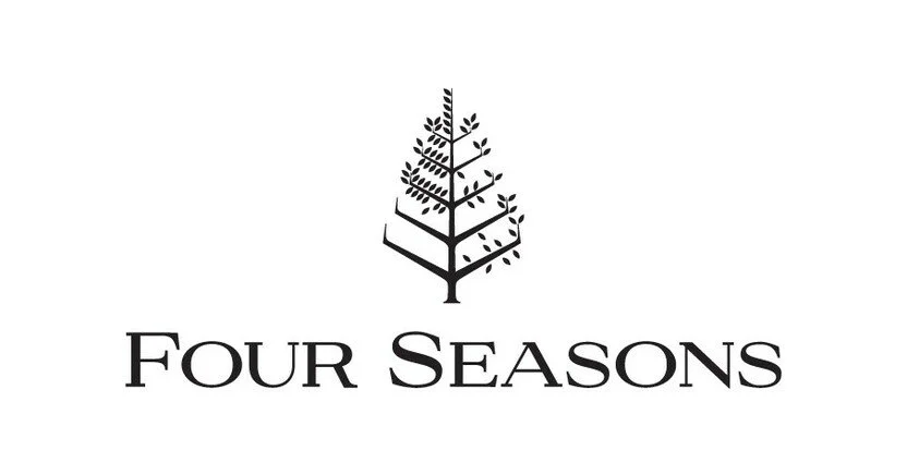 Logo featuring a stylized tree with four levels of branches and leaves, with the text 'Four Seasons' beneath it.