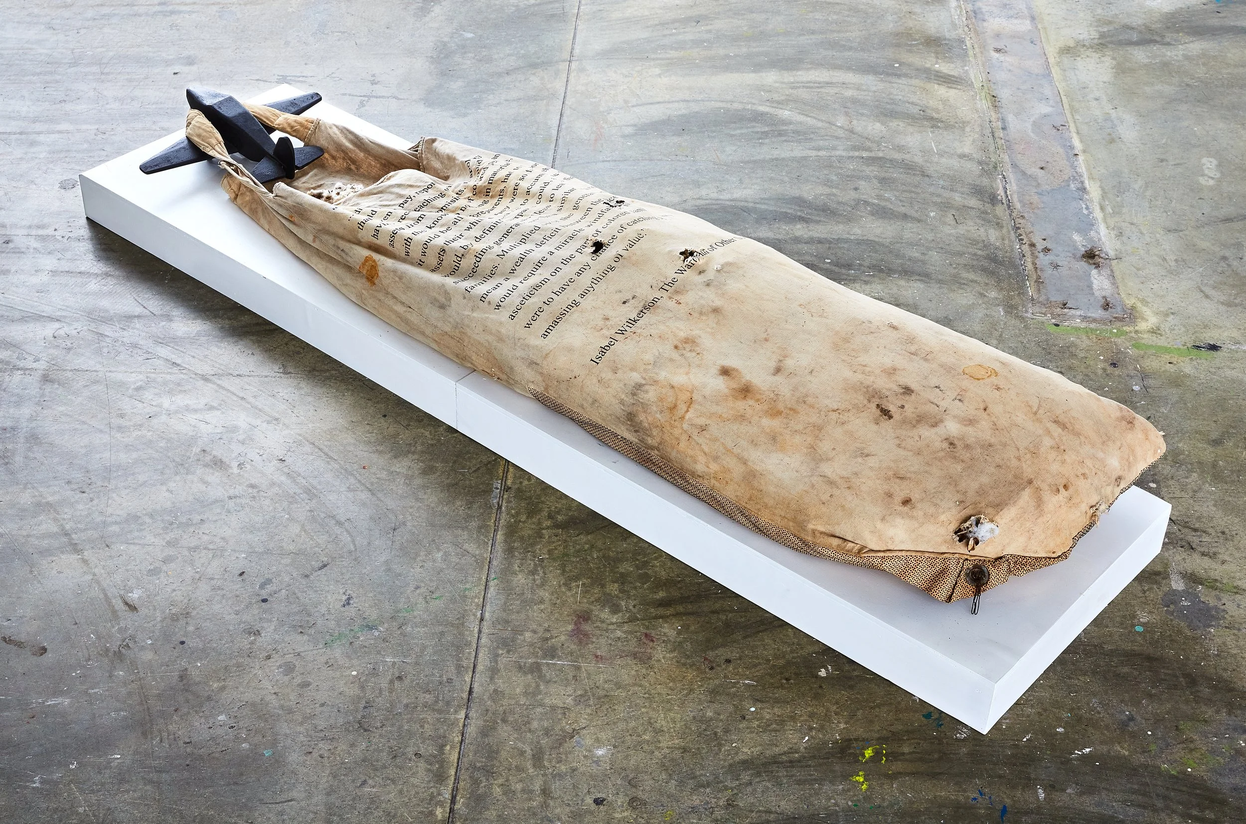 Grounded_2016_carved wood, tar, cotton sack, raw cotton,serigraph on cloth.
28"W x 94"L x 14"H
***photograph by Russell Kilgore***