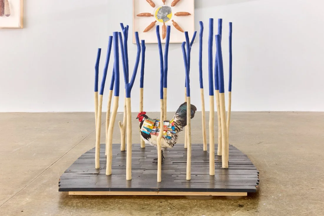 You Can't Cage My Strut, 2024.
Stuffed chicken, paper, photo transfer on paper, paint.
Description:  created in response to the carceral system that disproportionately ensnares Black men, this work references the qualities of survival associated with