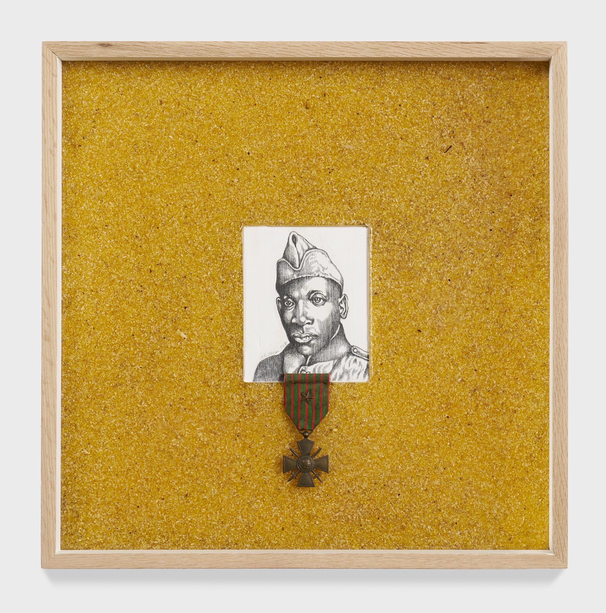 Food Notes #2: Grit for Henry L. Johnson;
2026.
16 ¾” x 16 ¾” x 2.5”
Graphite on wood panel, grits, resin, and French medal.
Description: Henry L. Johnson born in Winston-Salem, NC, was a WW1 hero who fought off a German raid party in the Argonne for