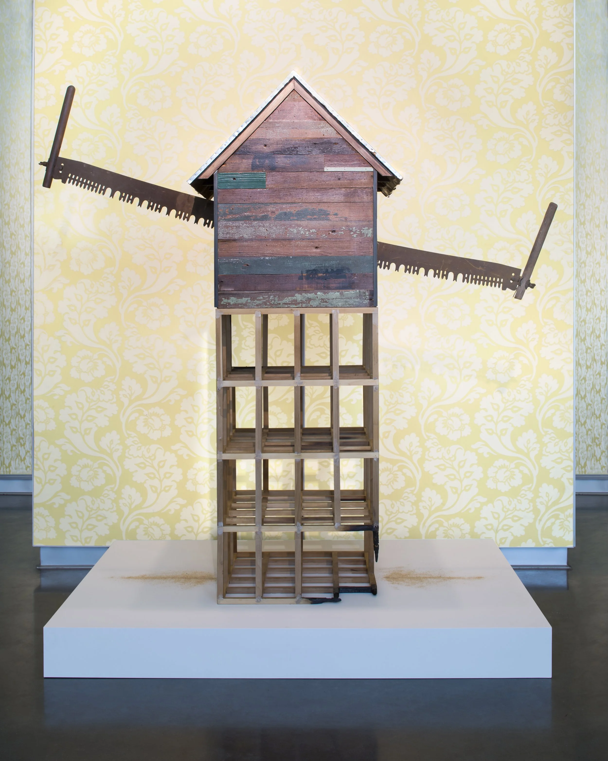 To Gut; 2016.  Wood, tin, steel, paint, serigraph on wood, and tree saw.  Photograph courtesy of SCAD Museum