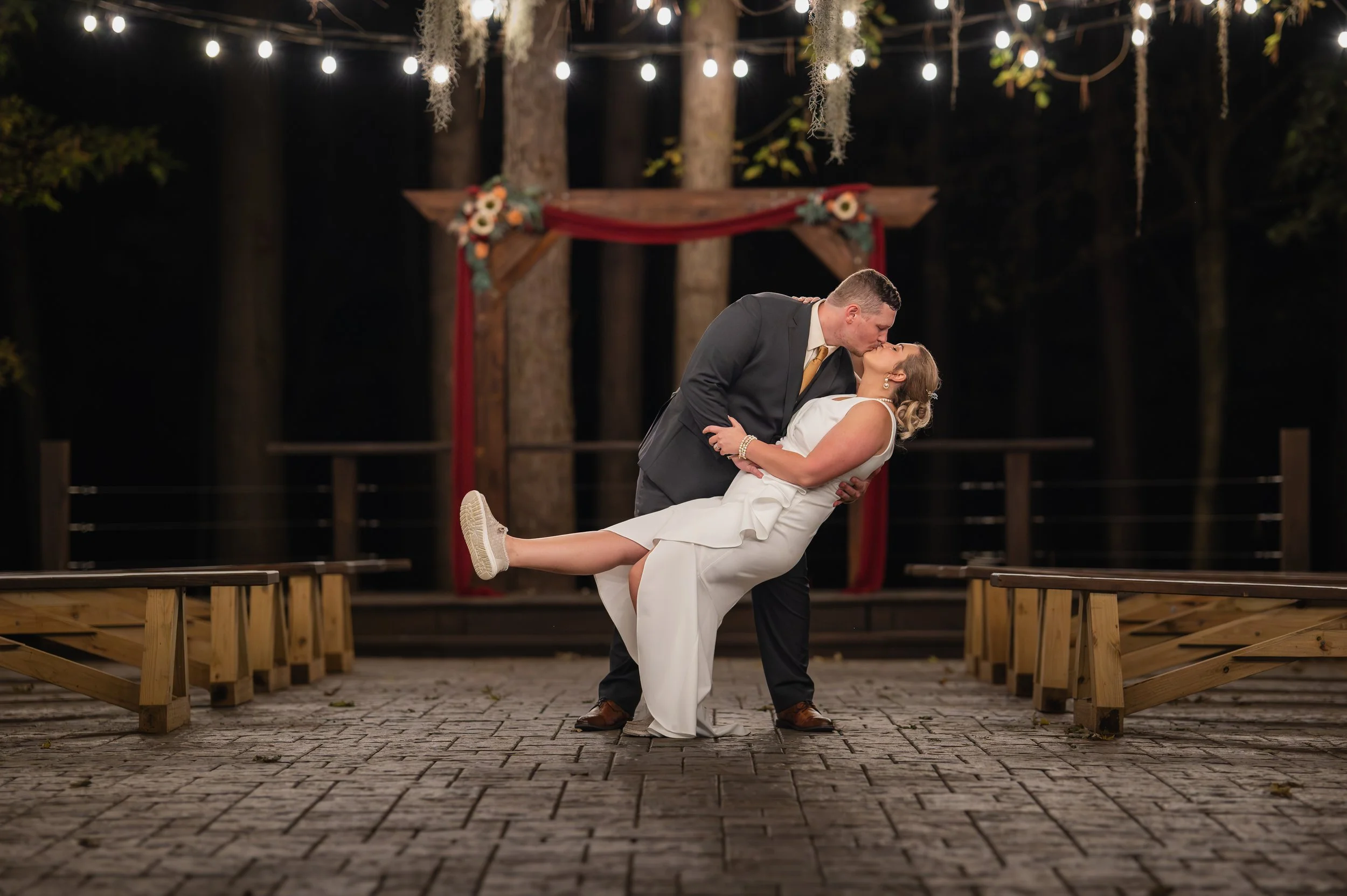 Bride and groom dancing under canopy lights at Hiwassee River Weddings