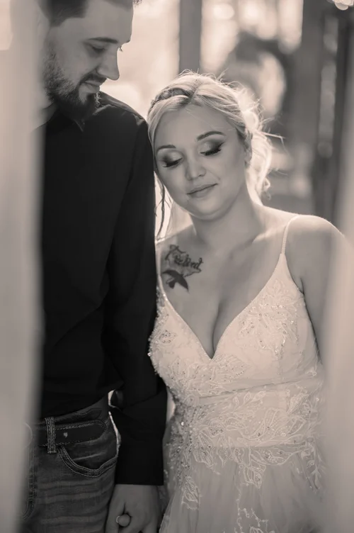 Bride and groom embracing during wedding portraits