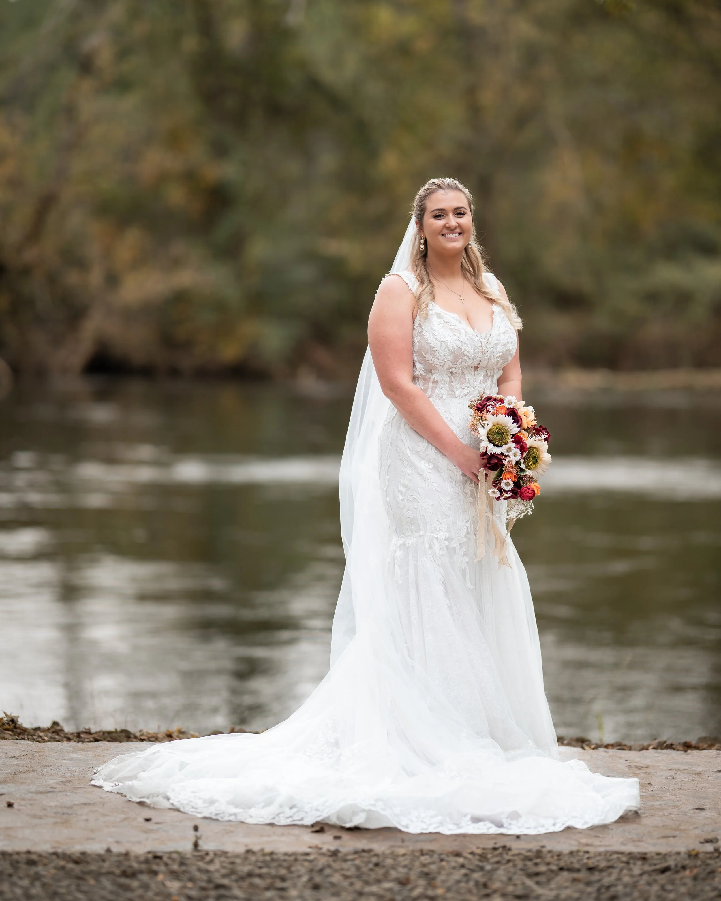 Bride portrait by the river at Hiwassee River Weddings in Delano Tennessee
