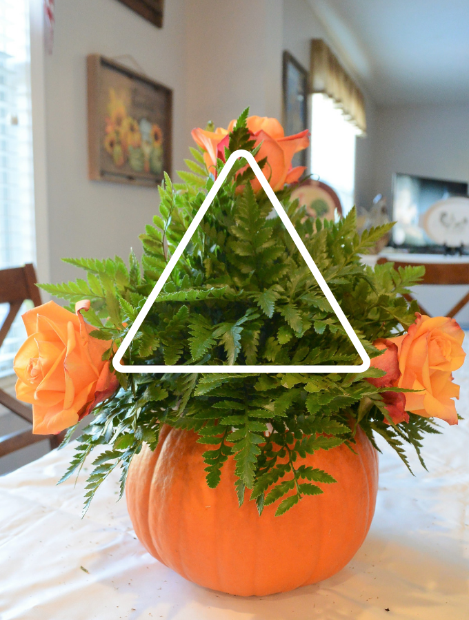 image showing how to place flowers on arrangement to create a triangle