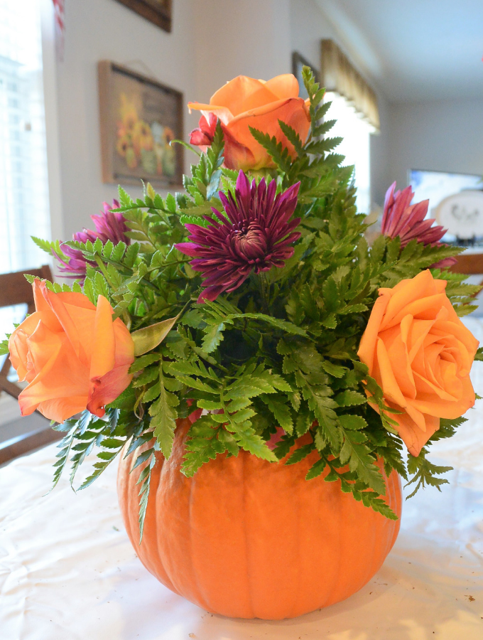 arrangement with roses and mums added