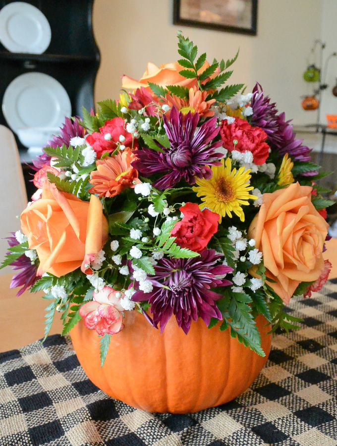 finished pumpkin centerpiece arrangement on table