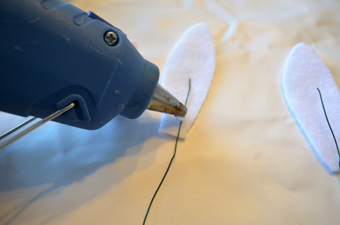 hot gluing bunny ears and wire