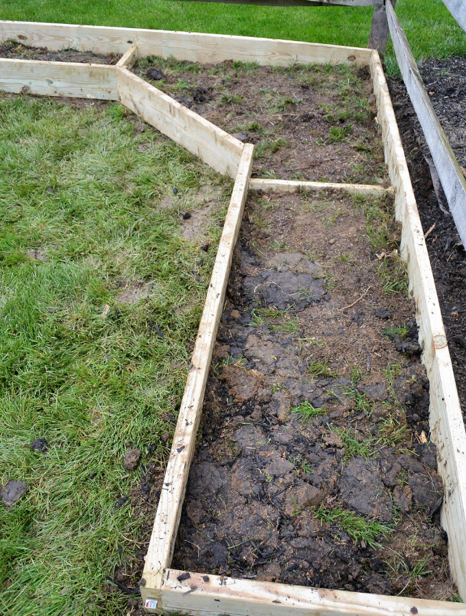 adding support pieces in the garden bed