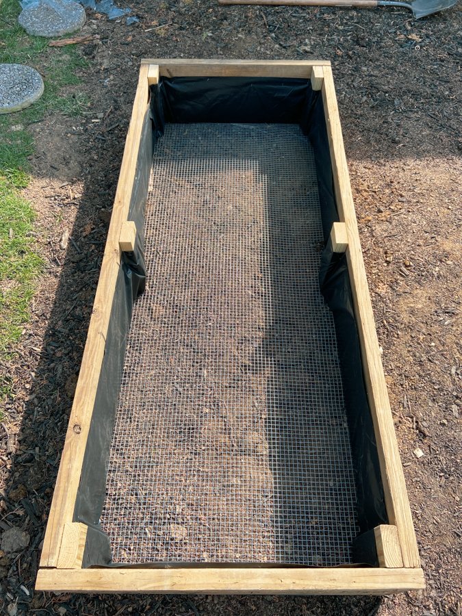 beds lined with plastic and chicken wire in bottom