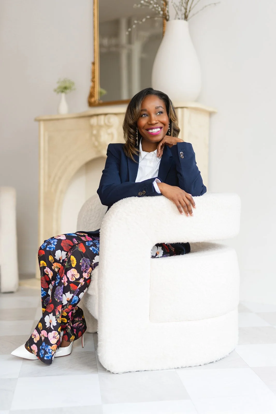 Chicagoland wedding planners smiling sitting in white chair