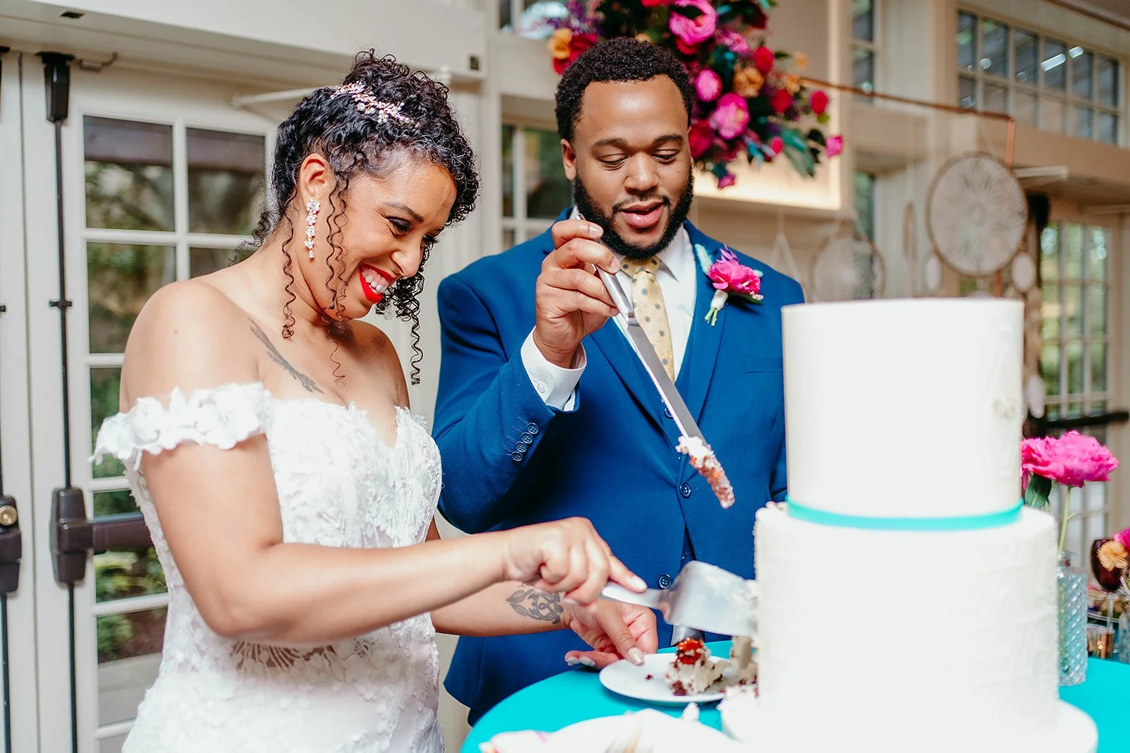 Bride and Groom Cut Wedding Cake and Community House In Winnetka