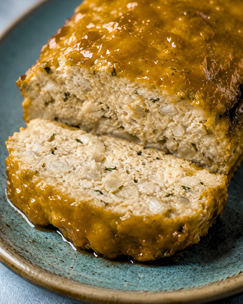 Photo of sliced garlic parmesan chicken meatloaf by Chef Jocelyn Harris