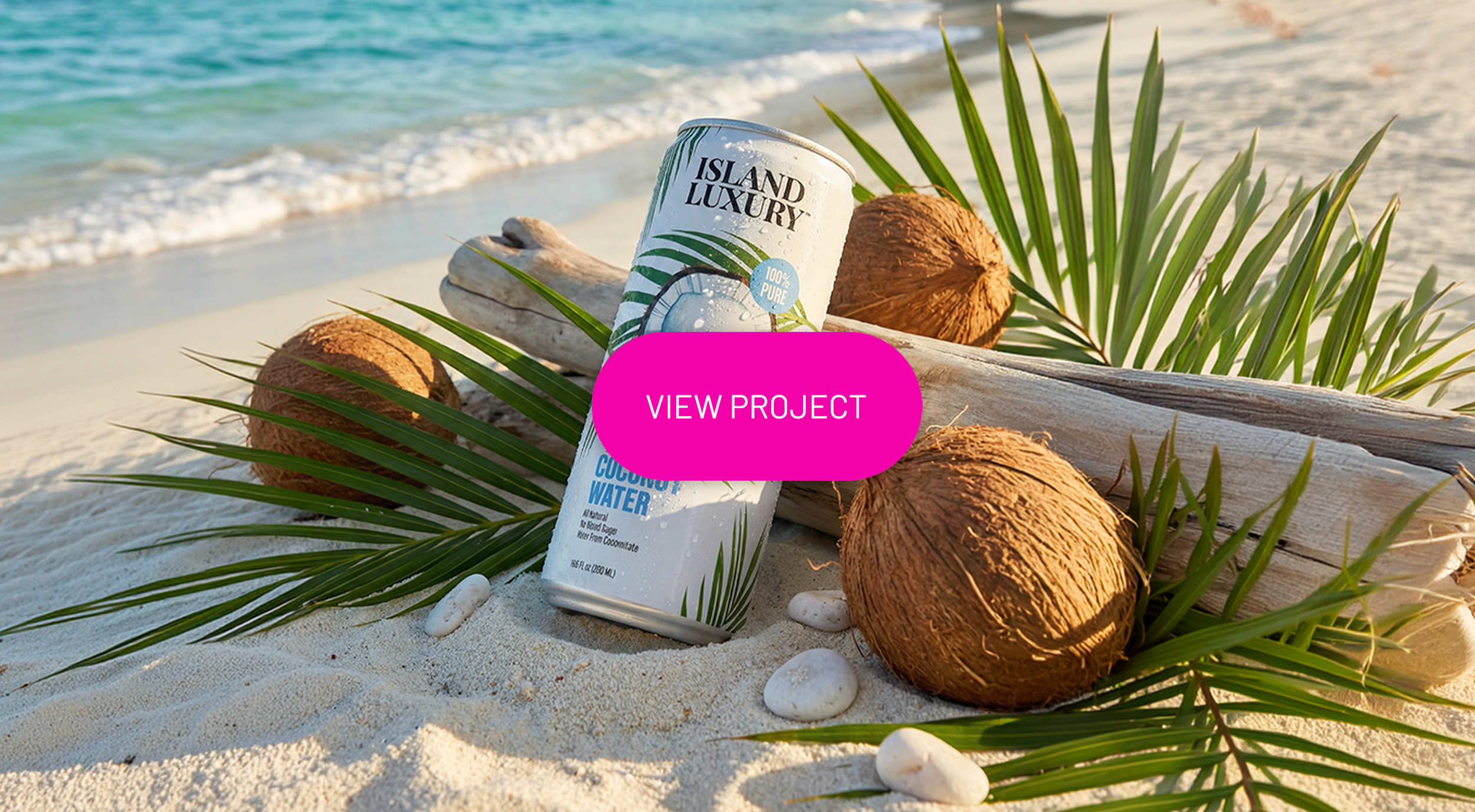 A can of coconut water on a sandy beach surrounded by palm leaves, coconuts, and white stones, with the ocean in the background and a pink 'View Project' button overlay.
