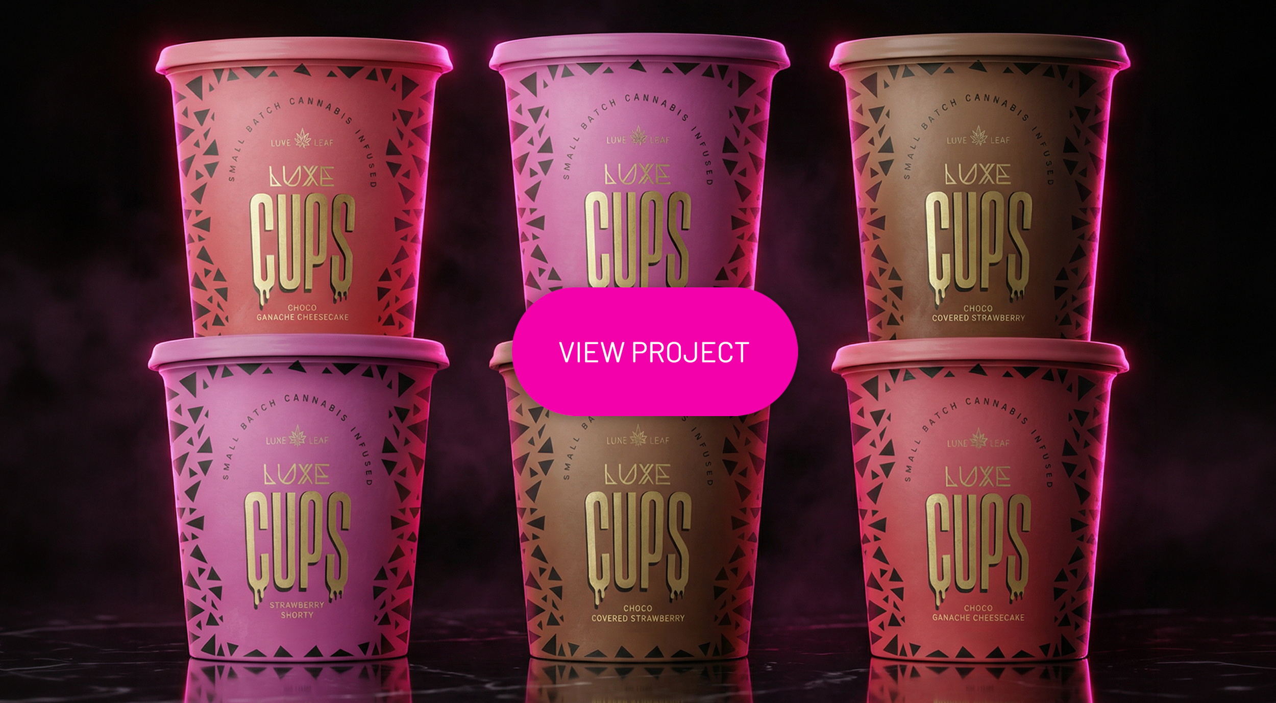 Six colorful disposable cups with the brand"LUXE CUPS" and various flavor descriptions, arranged in a 3x2 grid on a dark surface with a smoky background and a pink "VIEW PROJECT" button in the center