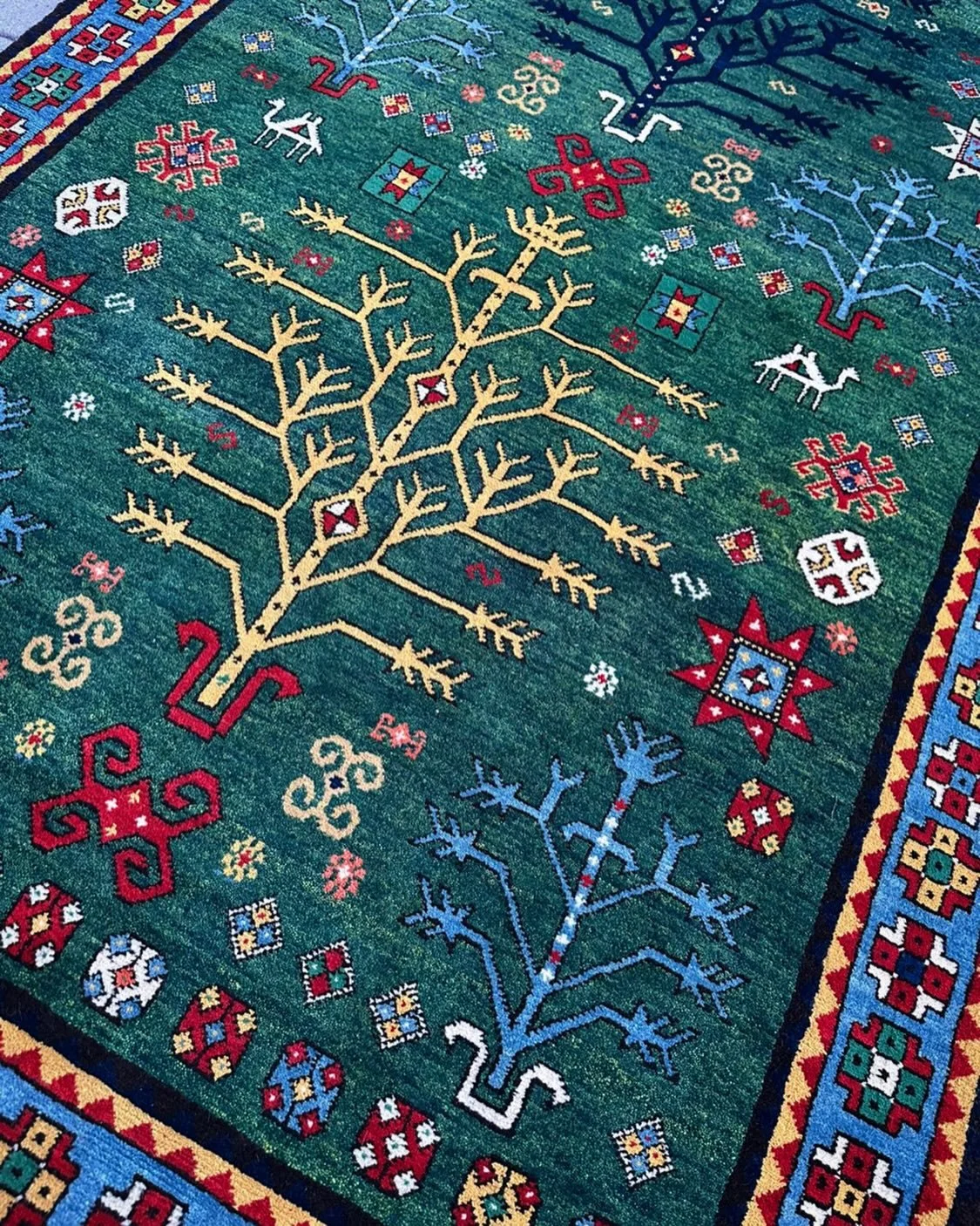 A happy 2026 to all from reWoven! The tree is a symbol not only of family but of growth and life itself. 
Thank you to all who have supported us this year, all who have bought our rugs, visited us on tours, told our story across the world. Without yo