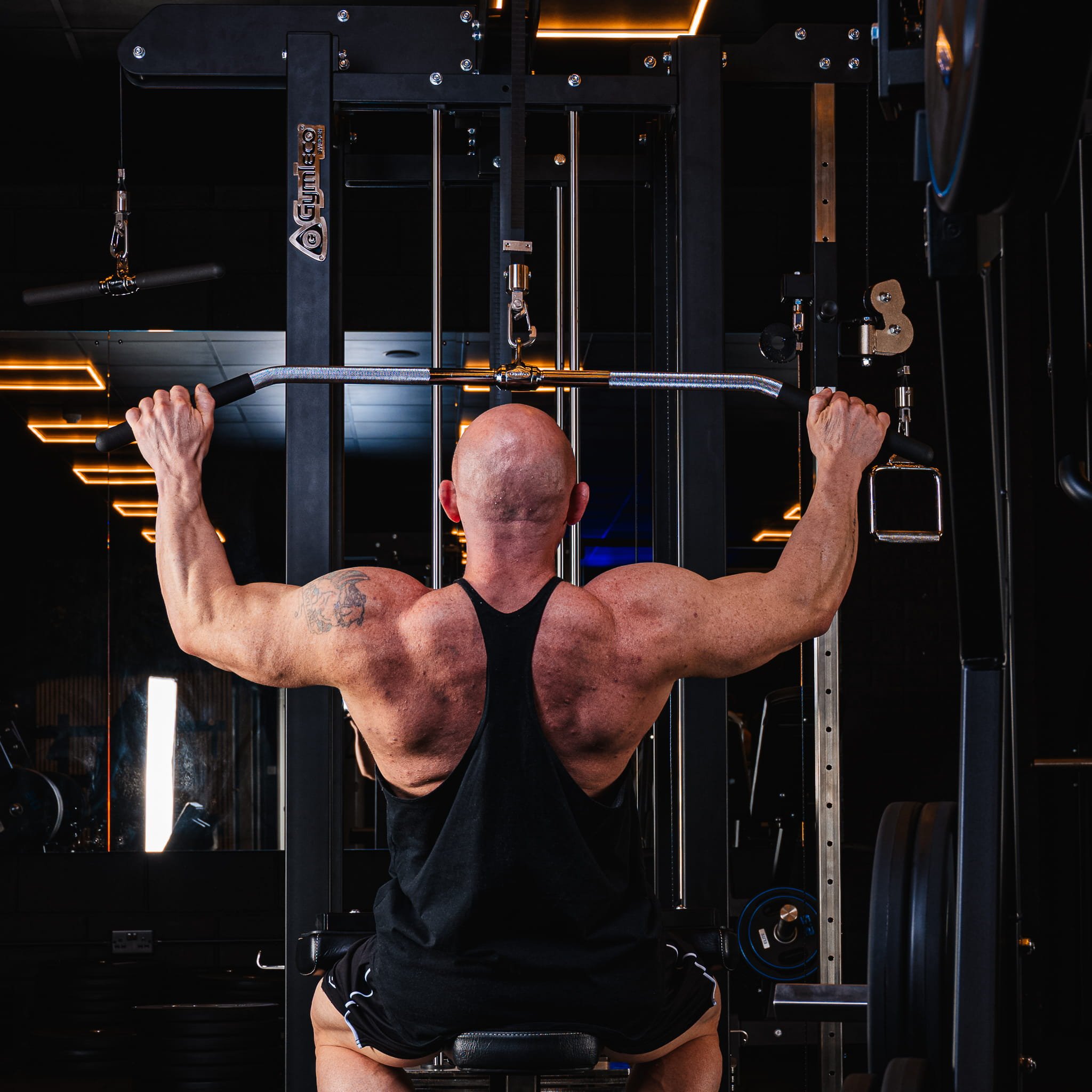 lat pulldown highlighting back muscle definition and focused technique.