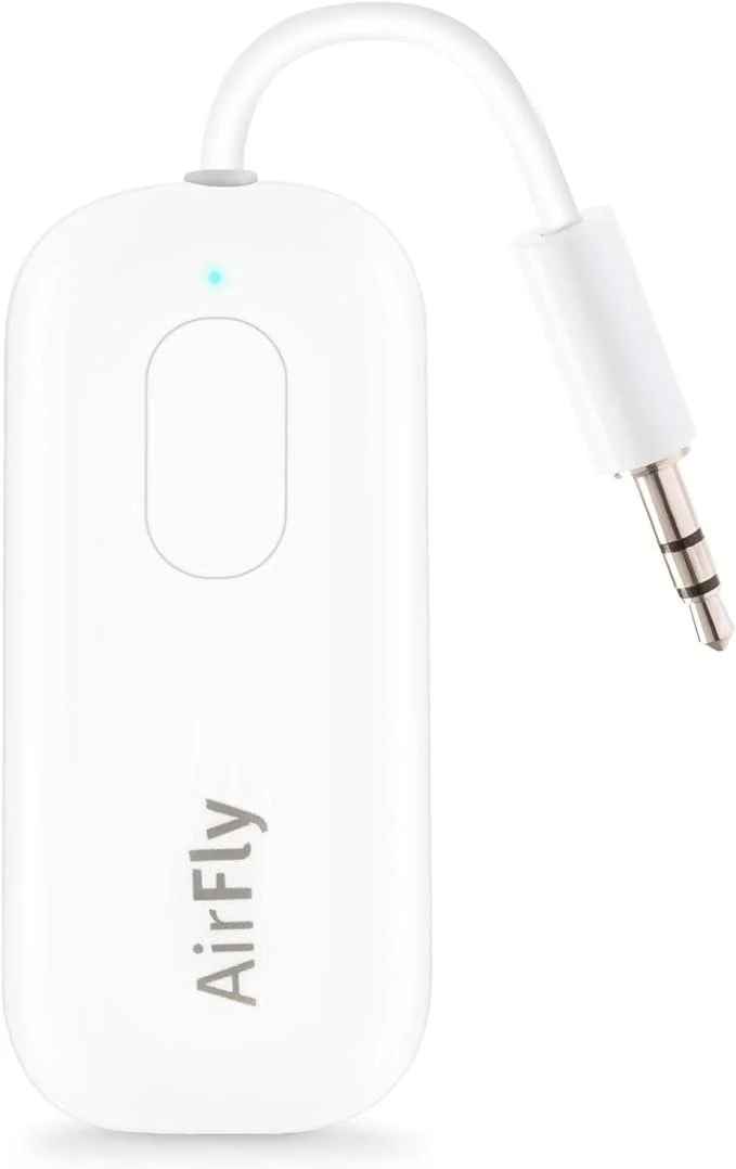 White wireless microphone transmitter with an attached 3.5mm audio jack, labeled 'AirFly'.