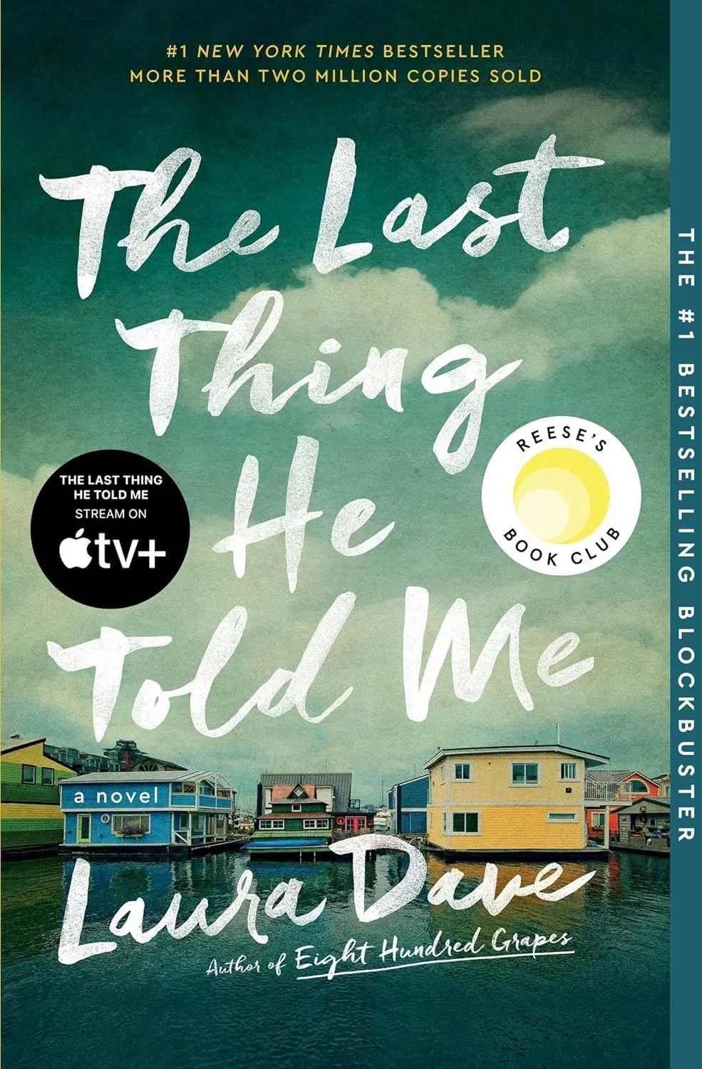 Book cover for 'The Last Thing He Told Me' by Laura Dave, featuring a cloudy sky over colorful coastal houses on water with text indicating it is a New York Times bestseller and can be streamed on Apple TV+.