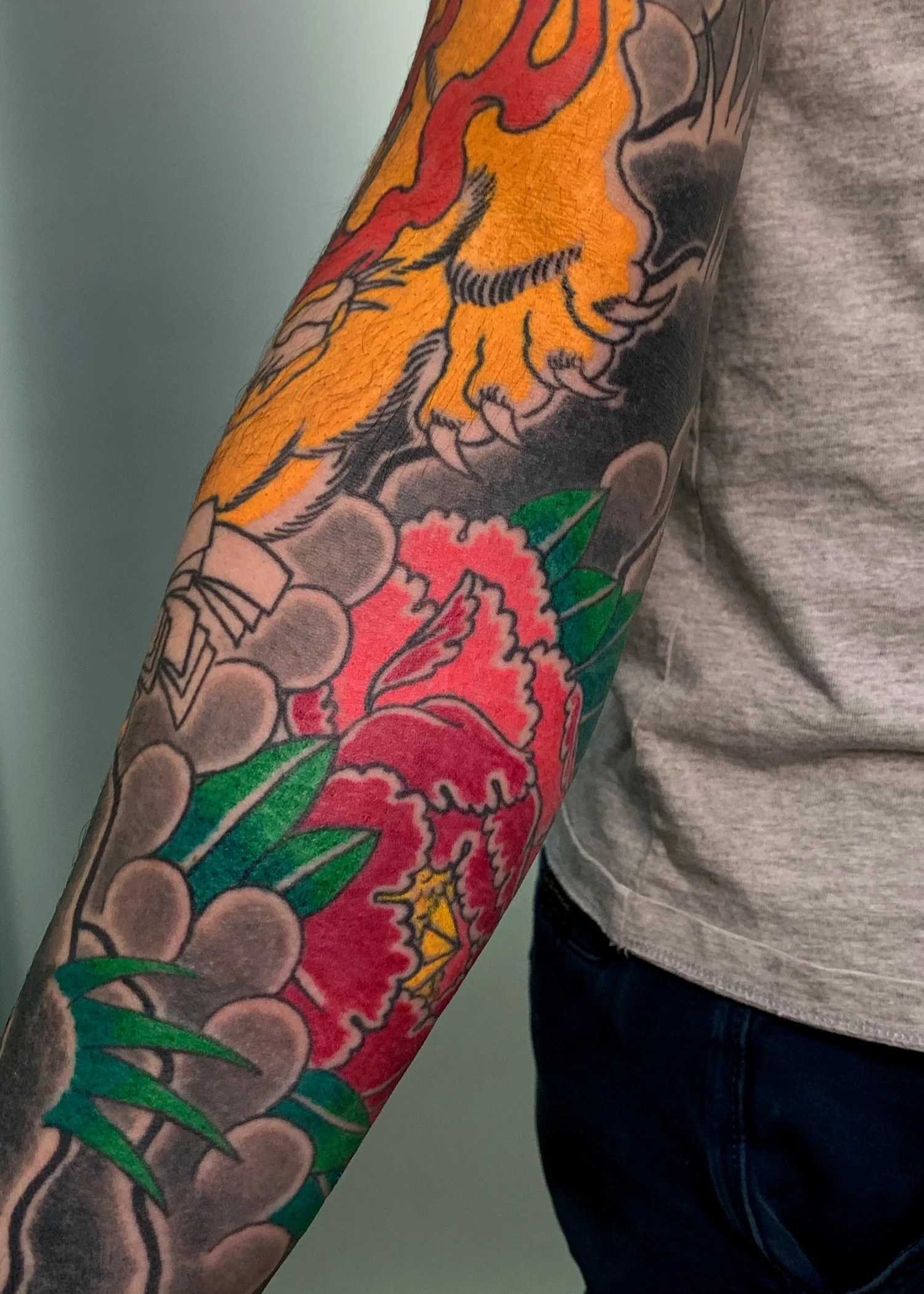 Kitsune & Peony Japanese Tattoo — Full Sleeve (Detail), Fort Lauderdale | Detail of a full sleeve featuring a kitsune (fox) and peony. Outline by machine; shading and color by hand using tebori. Healed.