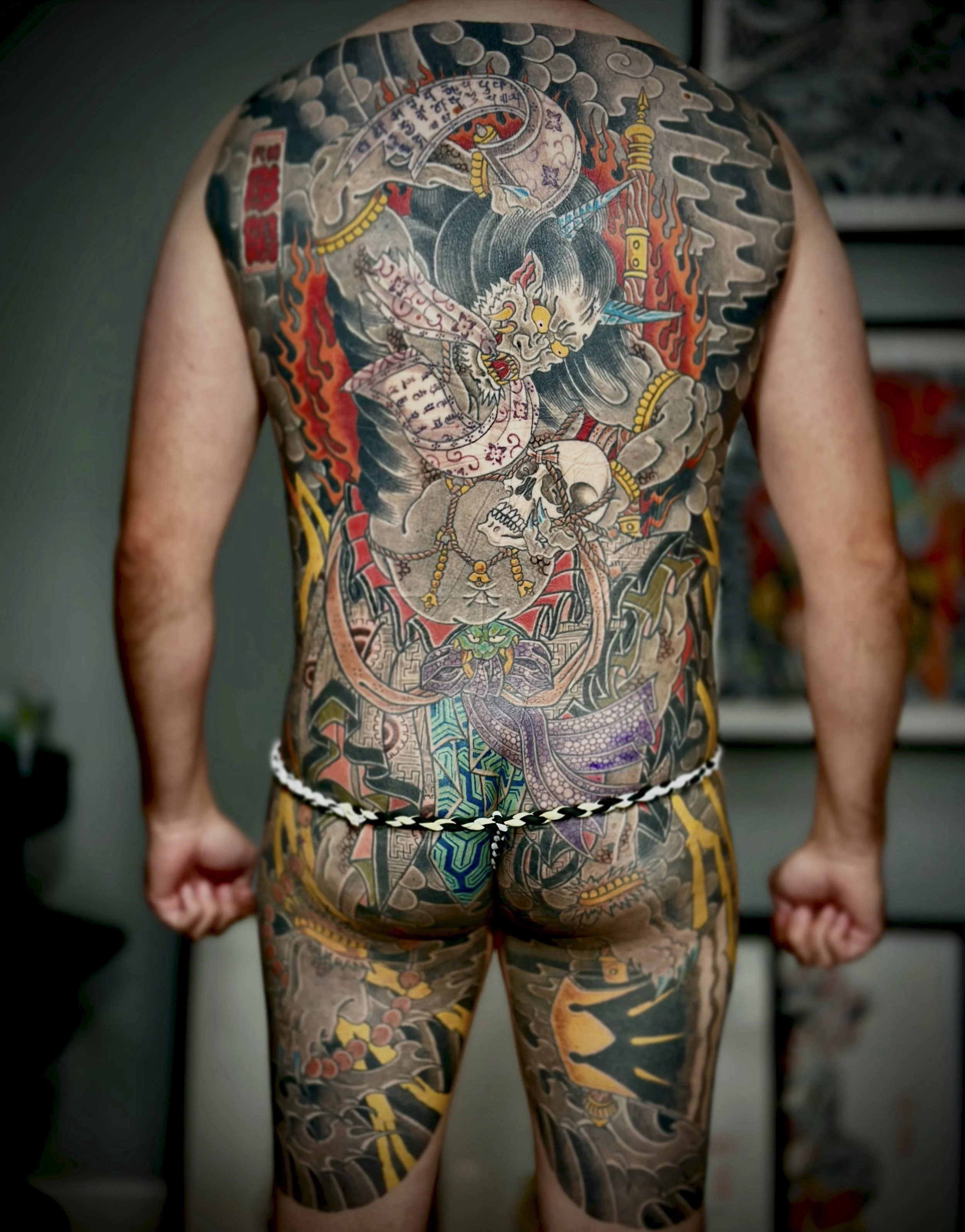 Kame-no-Koh Tebori Tattoo — Traditional Japanese Back Piece, Fort Lauderdale | A traditional kame-no-koh (turtle-back) backpiece featuring flame, cloud, and skull motifs. Outline by machine; all shading and color applied by hand using tebori. Healed.