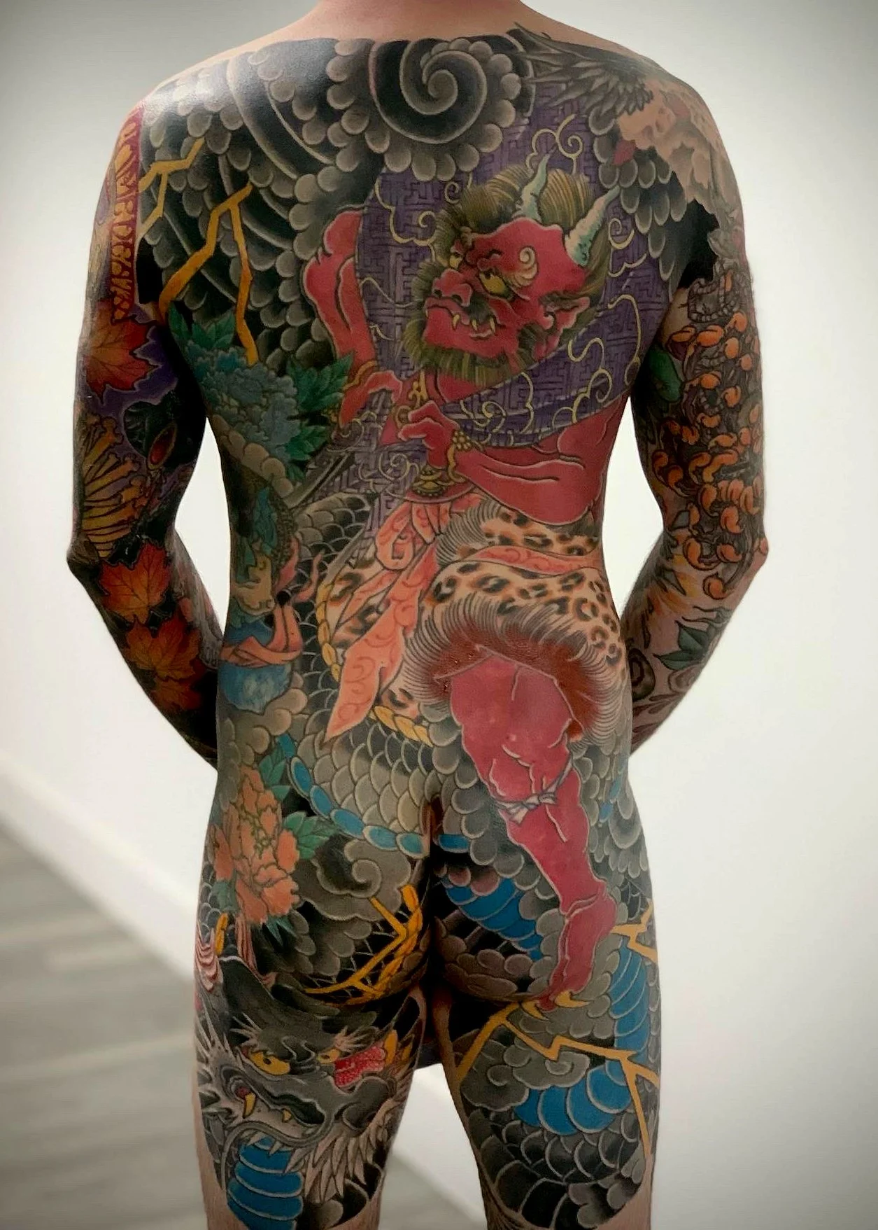 Fujin & Dragon Kame-no-Koh Tattoo — Traditional Back Piece, Fort Lauderdale | A kame-no-koh (turtle-shell) backpiece featuring Fujin, the Japanese god of wind, riding a dragon. Entirely machine work. Healed.