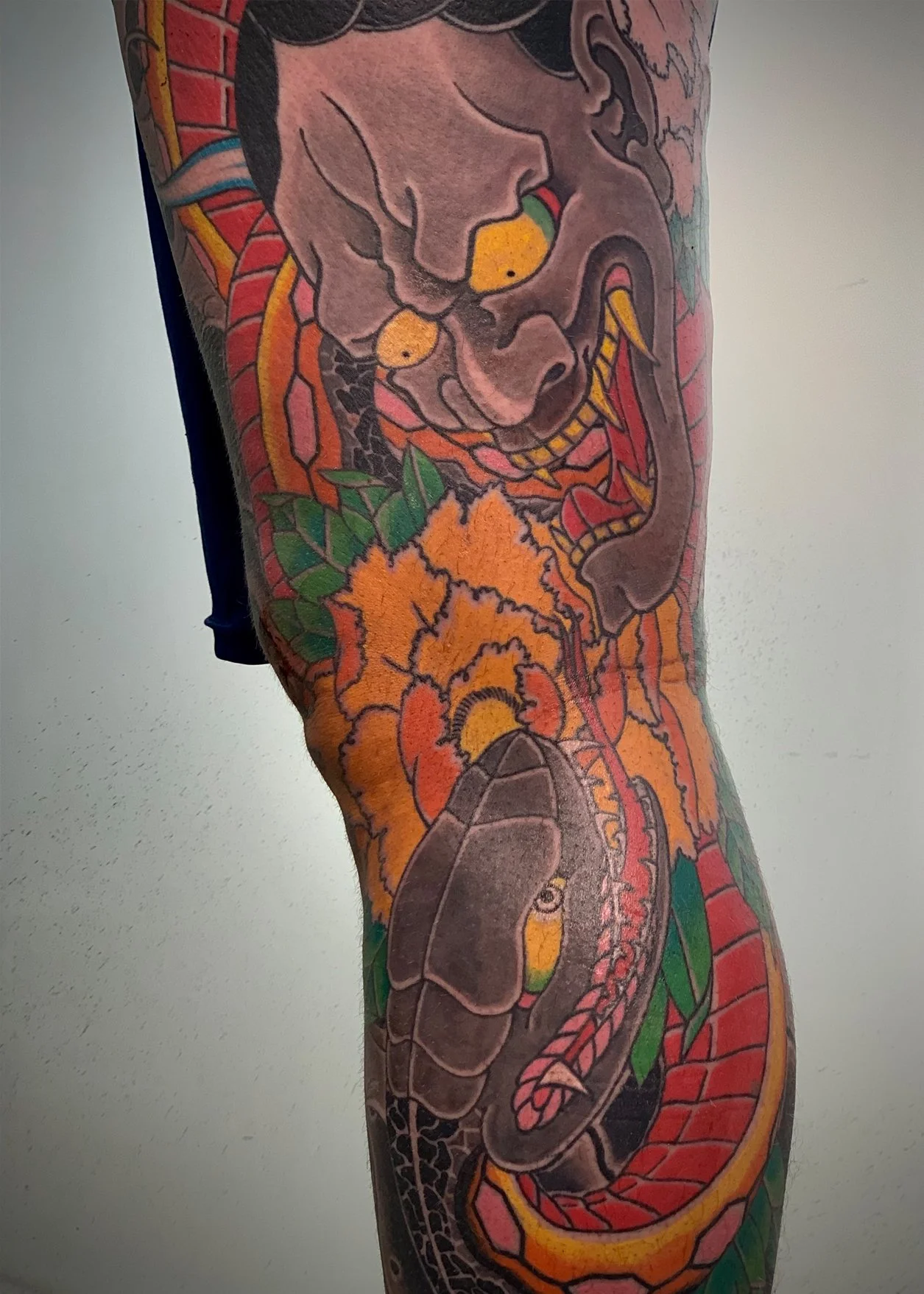 Hannya, Snake & Peony Japanese Tattoo — Leg, Fort Lauderdale (Detail) | Detail of a full leg tattoo featuring a hannya mask, snake, and peony. Entirely machine work. Healed.