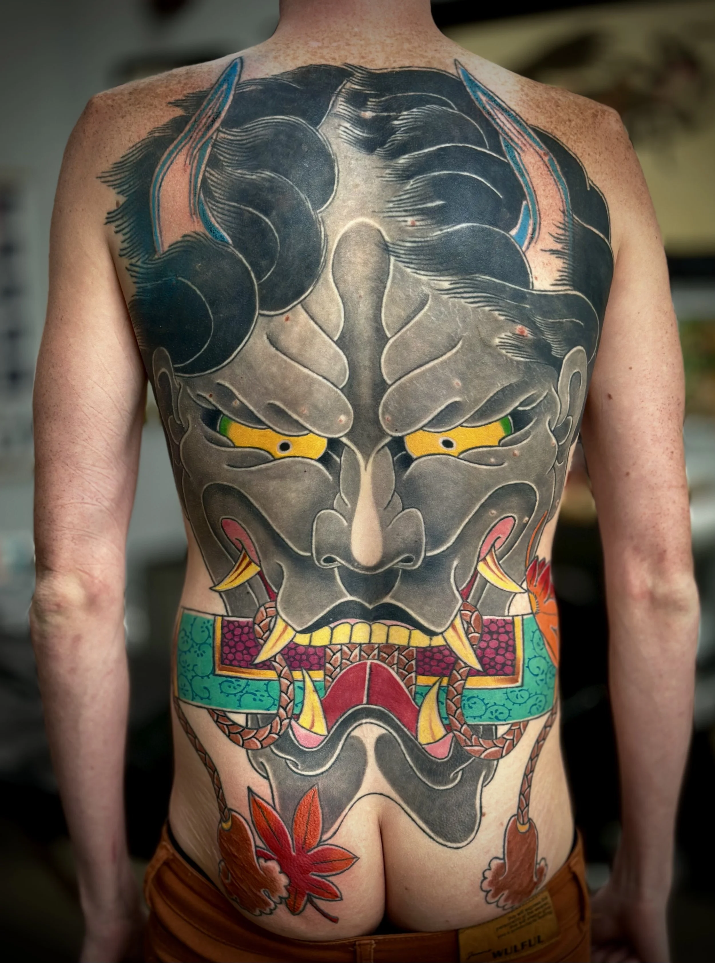 Hannya Mask Japanese Tattoo — Back & Glute Piece, Fort Lauderdale | A back and glute piece featuring a hannya mask with a scroll and maple leaves. Entirely machine work. Healed.