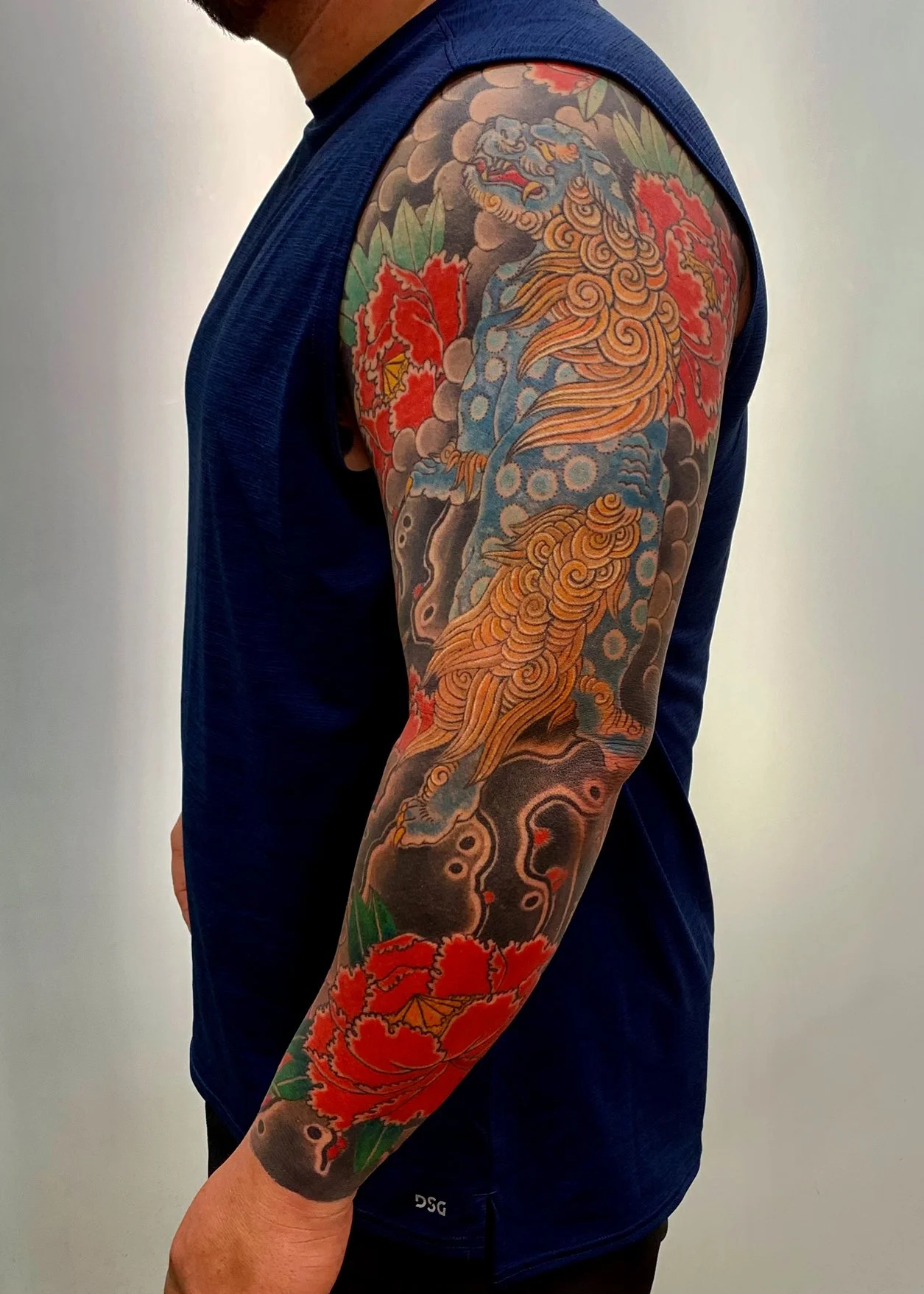 Shishi & Peony Japanese Tattoo — Full Sleeve, Fort Lauderdale | A full sleeve featuring shishi (lion-dog) with peonies, a traditional pairing in Japanese tattoo art. Entirely machine work. Healed.