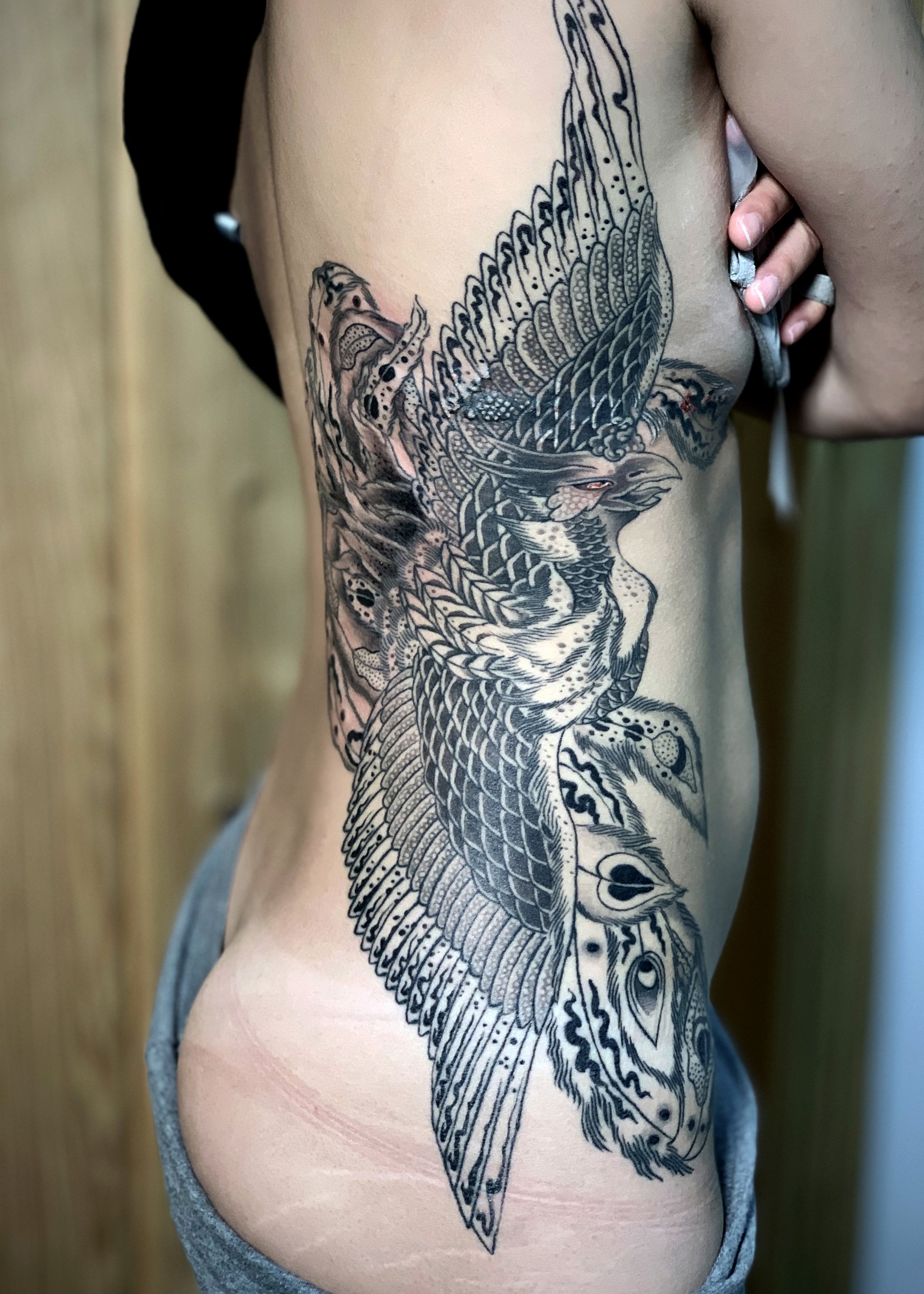 Phoenix Japanese Tattoo — Ribs & Partial Back, Fort Lauderdale | A phoenix tattooed across the ribs and partial back in black-and-grey. Entirely machine work. Healed.