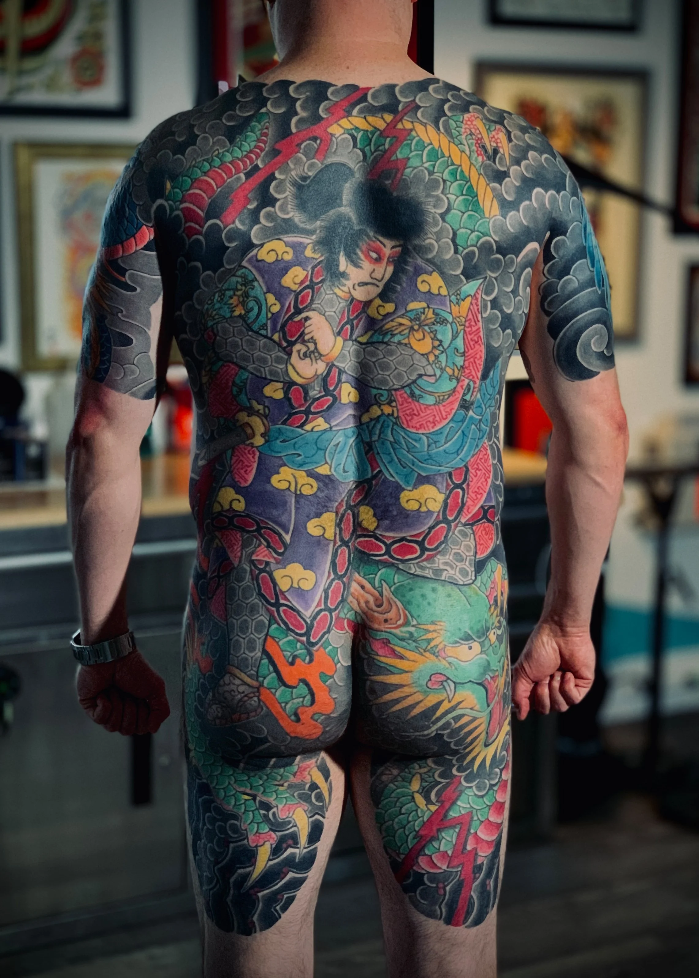 Ryu Maru — Kame-no-Koh Back Piece, Fort Lauderdale | A kame-no-koh (turtle-shell) backpiece extending across the back, buttocks, and thighs, depicting Ryu Maru with a warrior figure. Entirely machine work. Healed.