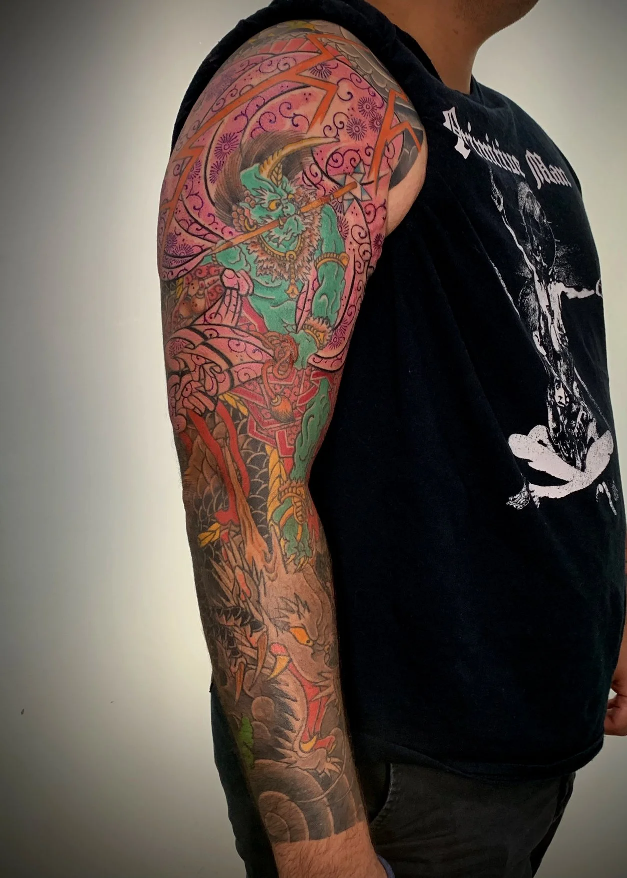 Fujin (Wind God) Japanese Tattoo — Full Sleeve, Fort Lauderdale | A full sleeve featuring Fujin, the Japanese god of wind, together with a dragon. Entirely machine work. Healed.