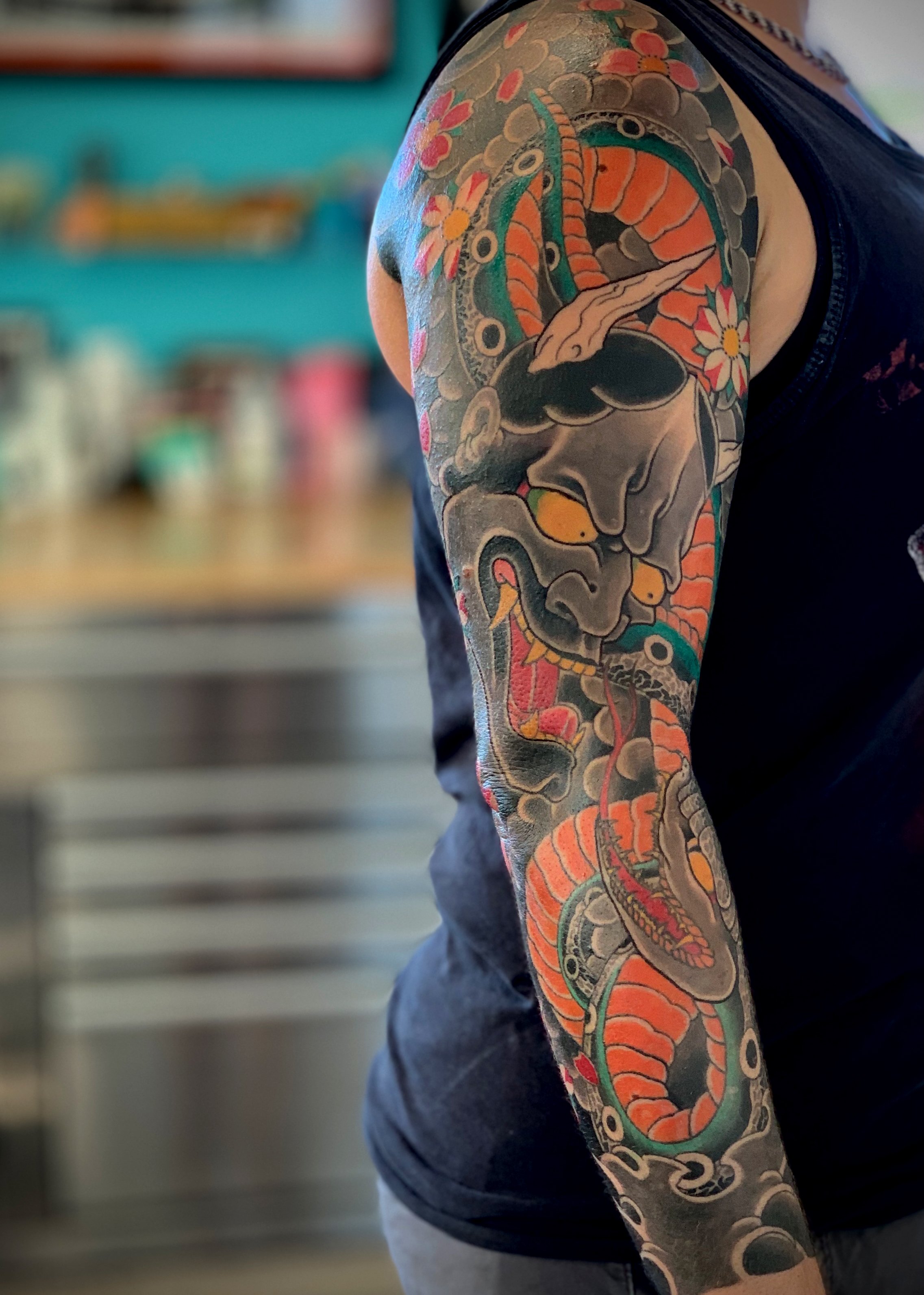 Hannya, Snake & Cherry Blossom Japanese Tattoo — Full Sleeve, Fort Lauderdale | A full sleeve featuring a hannya mask, snake, and cherry blossoms. Entirely machine work. Healed.
