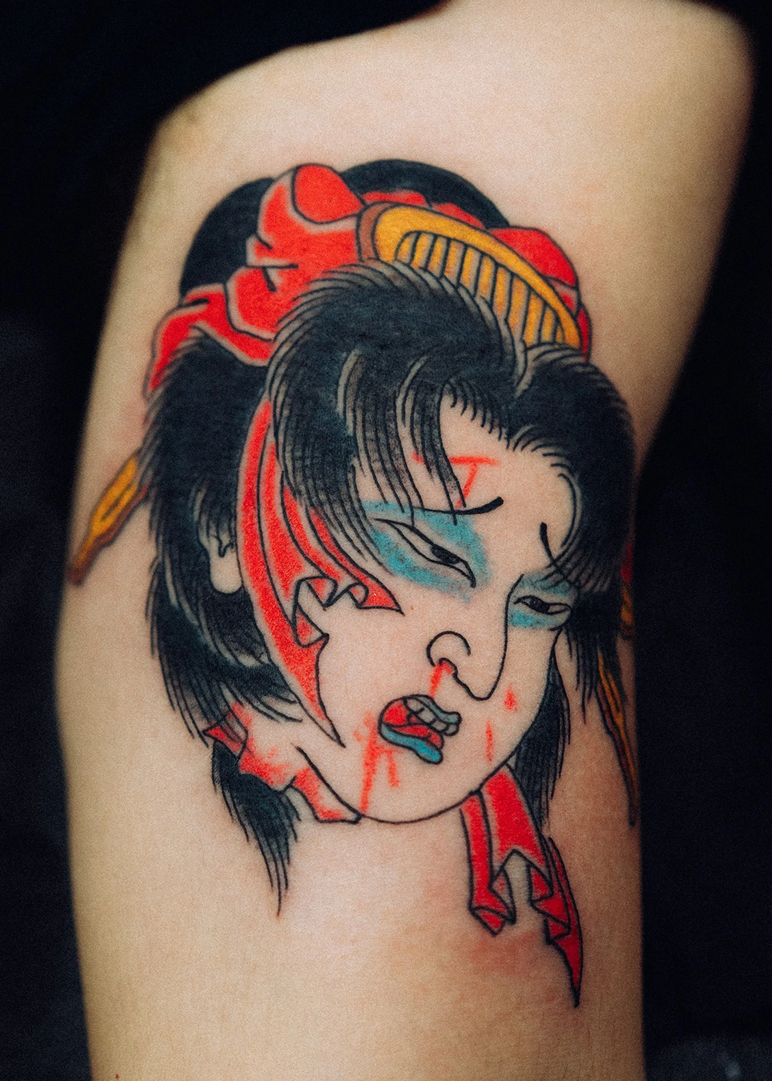 Namakubi Japanese Tattoo — Upper Arm, Fort Lauderdale | A namakubi (severed head) tattoo depicting a courtesan figure. Outline by machine; shading and color by hand using tebori. Healed.