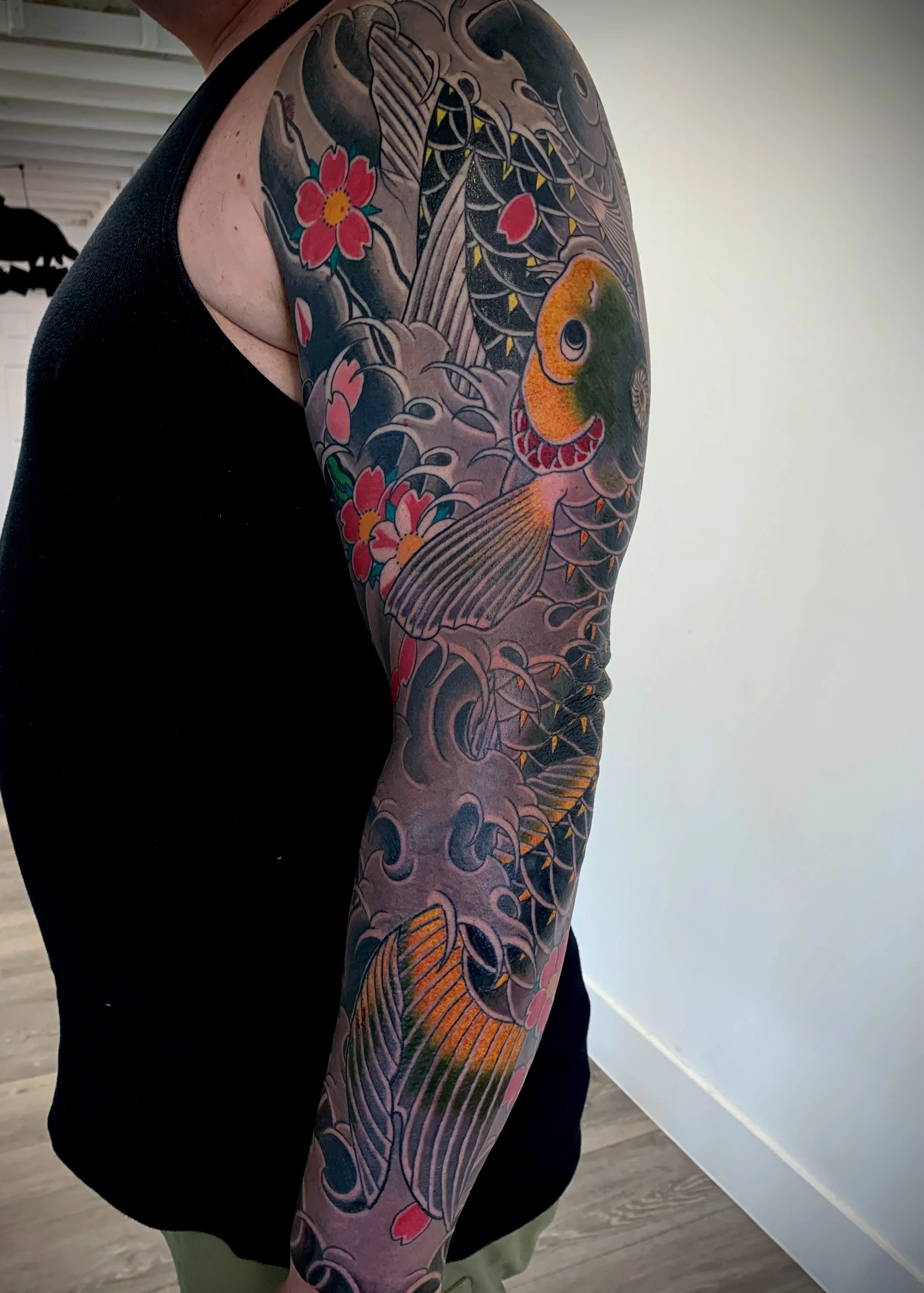 Koi, Cherry Blossom & Water Japanese Tattoo — Full Sleeve, Fort Lauderdale | A full sleeve featuring koi, water with cherry blossoms. Entirely machine work. Healed.