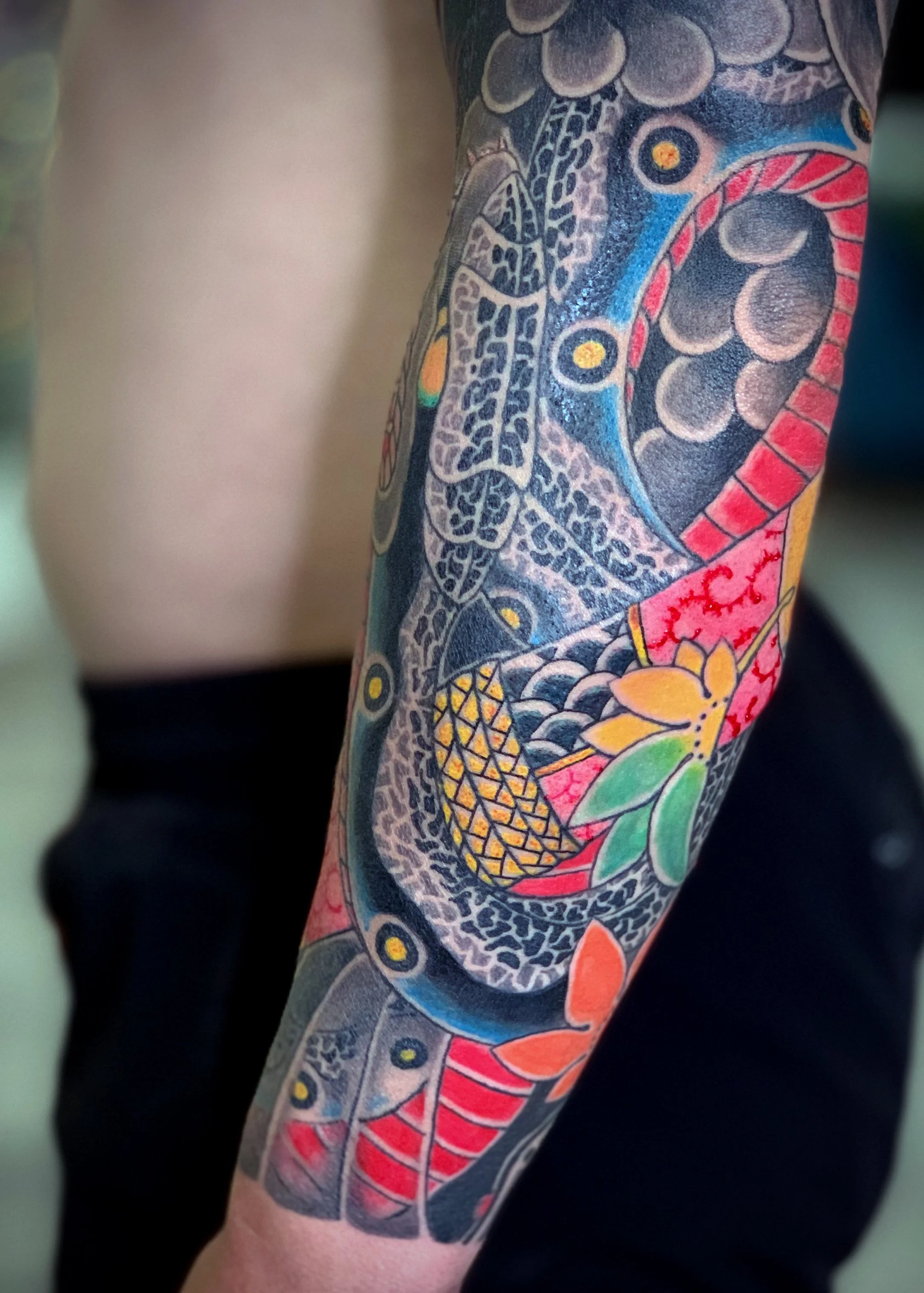 Detail of a Snake & Maple Leaf Japanese Tattoo — Forearm, Fort Lauderdale | A forearm tattoo featuring a Snake with maple leaf accents. Entirely machine work. Healed.