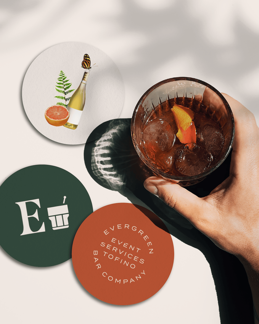 Branded coasters and cocktail photography for Evergreen Bar Company