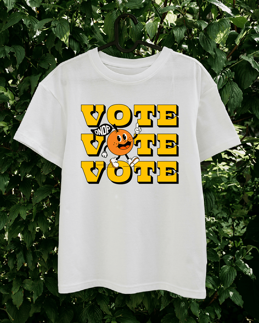 Campaign merchandise T-shirt promoting voter turnout with bold typography and illustrated Ontario NDP mascot