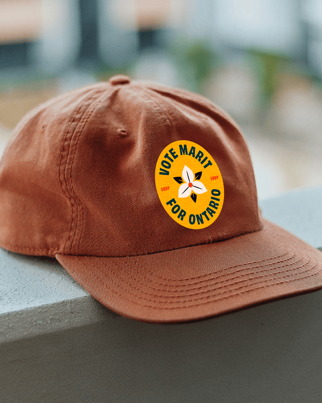 Ontario NDP campaign hat featuring a “Vote Marit for Ontario” button with trillium icon
