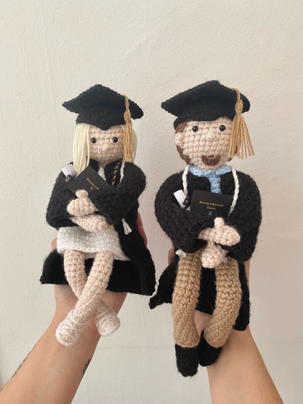 Graduation Dolls in Hands.jpg