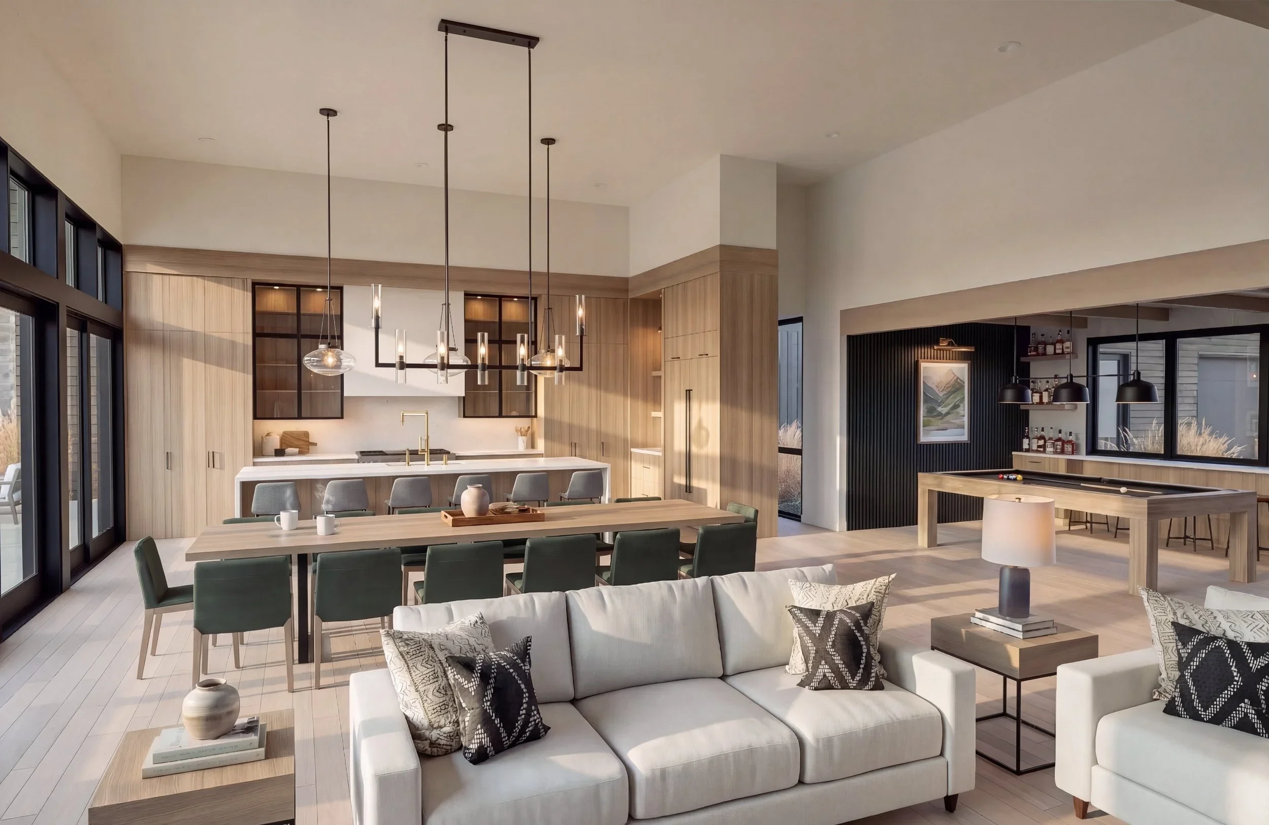 Modern open-concept living space and kitchen with neutral tones, large windows, and minimalist decor.