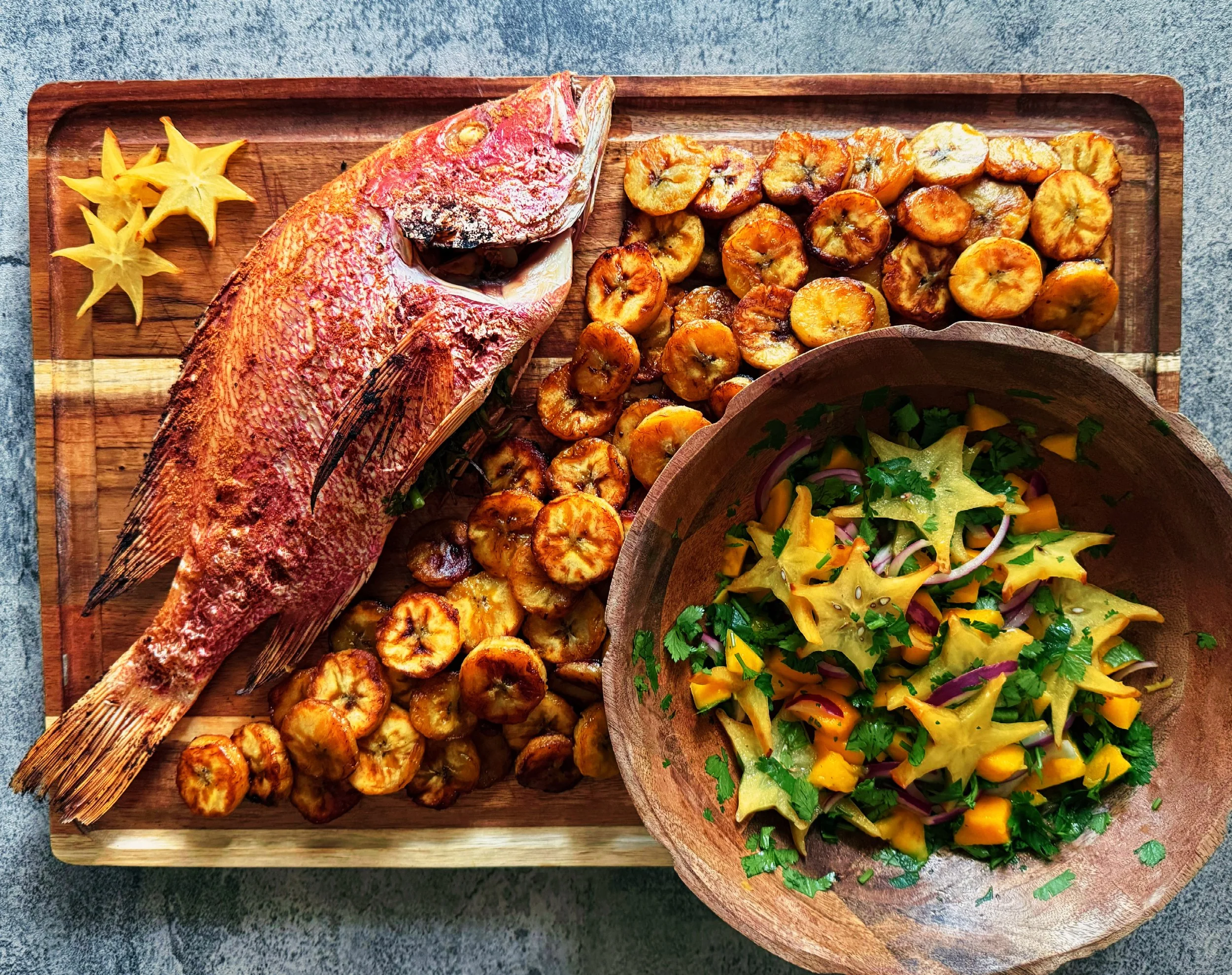 red snapper with starfruit salad and fried plantains