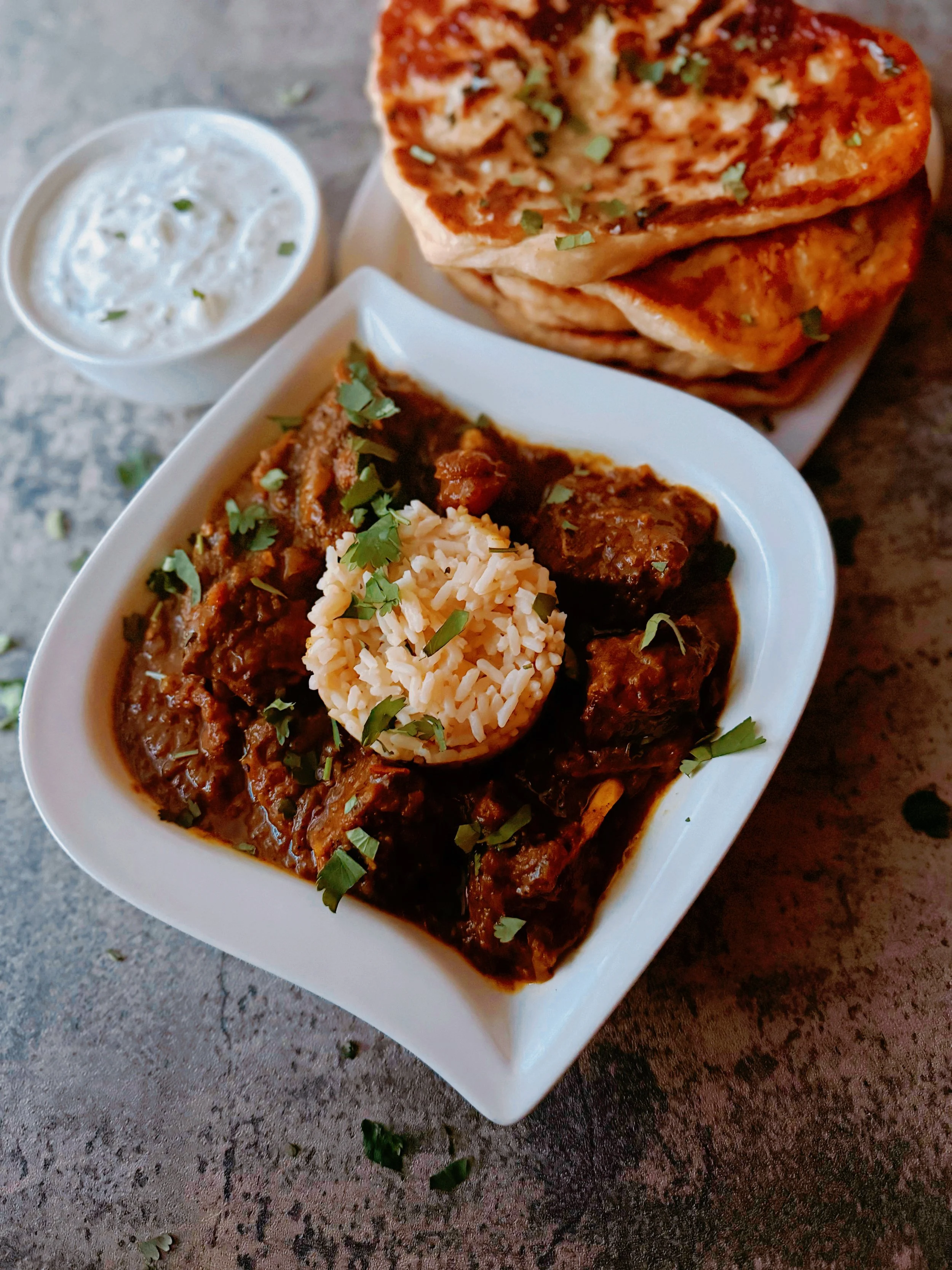 mango curry goat with naan and raita — trails and tarragon