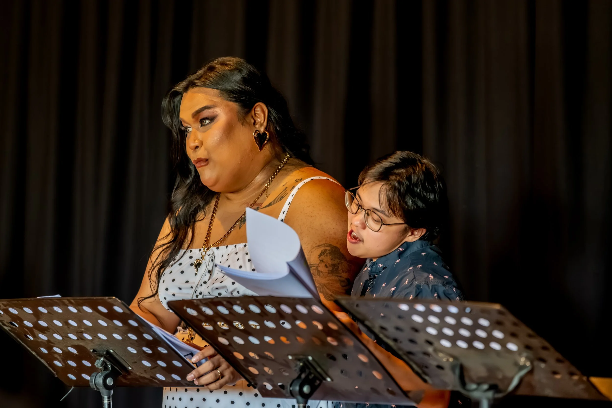 One human cuddles another.