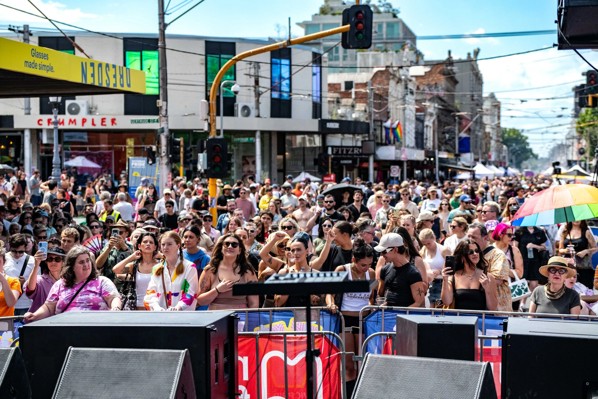 A large crowd watches the main stage of VIC Pride.
