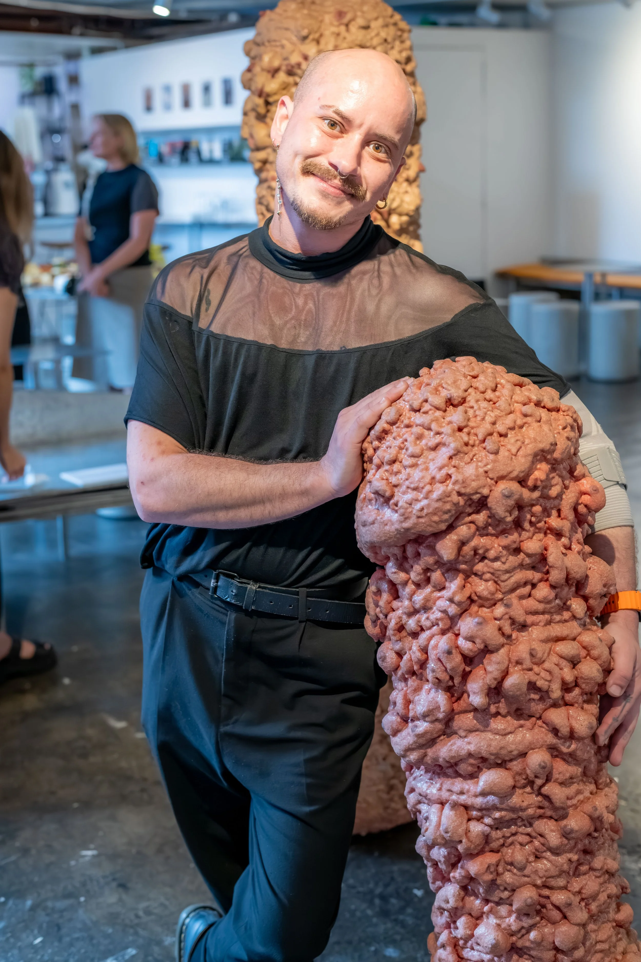 An artist with their artwork.